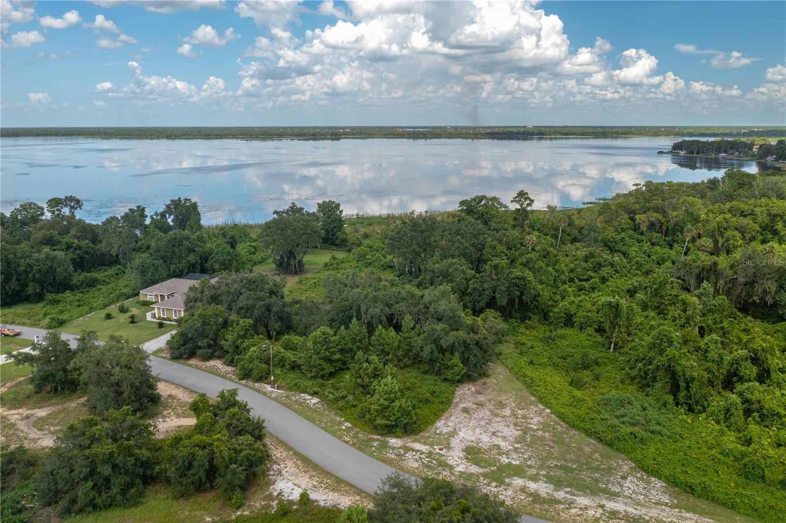 Double Lot on Lake Marion – Nearly 2 Acres - Build your dream home on this expansive double lot offering nearly two acres of prime land along the shores of beautiful Lake Marion. This rare property provides the perfect setting for a custom home with ample space for outdoor living areas, gardens, and recreational amenities. Enjoy the tranquility of lakefront living with stunning water views in a quiet subdivision just south of Grenelefe and Haines City. Lake Marion is a spring-fed lake spanning over 5,600 acres with more than 20 miles of shoreline—a paradise for boating, kayaking, and world-class bass fishing. Nature enthusiasts will appreciate being near the Lake Marion Creek Wildlife Management Area (WMA), which offers more than 8,000 acres of preserved land featuring hiking trails, fishing spots, and abundant wildlife such as white-tailed deer, feral hogs, wading birds, Florida scrub-jays, and gopher tortoises. Additional Details: Combined nearly 2-acre double lot; All measurements are approximate & buyer to verify; Peaceful, established neighborhood; Convenient to Grenelefe, Haines City, and surrounding amenities. Whether you envision a private retreat, an active waterfront lifestyle, or both, this property offers endless possibilities in one of Polk County’s most scenic settings.