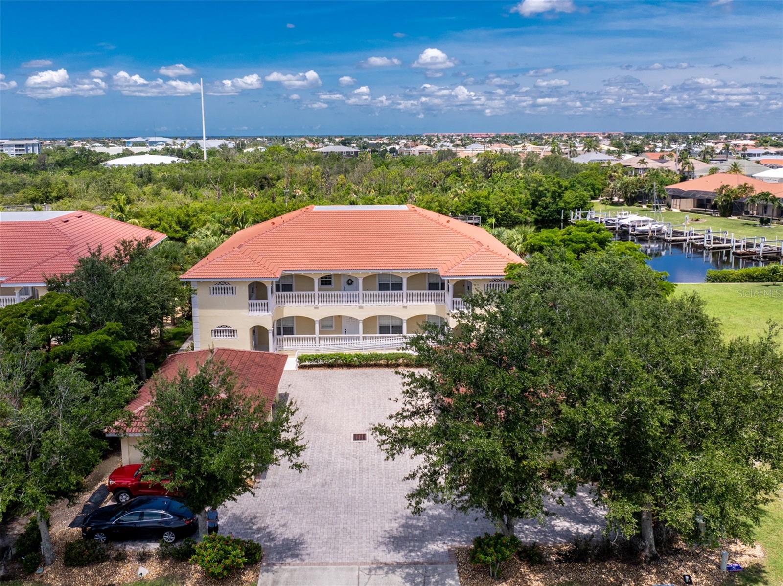 Impressive WATERFRONT 2 Bedroom *plus* Den/Office, 2 bathroom second floor FURNISHED unit. Located on a dead end street at ESTUARY AT PUNTA GORDA ISLES, in a desirable deed restricted community. This unit has a detached one car garage #122 with garage door opener and shelving- and a DEEDED DOCK #4. SAILBOAT ACCESS to Charlotte Harbor and on to the Gulf of Mexico. This impeccably maintained and updated unit has an open and split bedroom floor plan with Foyer, Great Room, Dining Area, well appointed Kitchen, Inside Laundry Room and and rear screened lanai. The spacious Kitchen features a tray ceiling, wood cabinets, granite counters, custom tile backsplash, double sink, stainless appliances, disposal and breakfast bar that seats 3/. Great counter and storage space. Appliances include a built in microwave, oven/range, dishwasher, double door refrigerator. The Kitchen is open to the large Great Room with Dining Area, diagonal lay floor tile, and sliding glass doors to the screened Lanai. The Inside Laundry room offers front loading washer and dryer, sink, cabinets and great counter space for folding. The Master Bedroom suite has a large window with great water view, tray ceiling, two double closets and private bathroom with his and hers sink, counter storage cabinet between the sinks and walk in shower. There is a generous sized guest bedroom with double closet. The spacious office/den is currently set up as a third bedroom. (no closet) The guest bathroom offers a tub/shower combination. Your living space extends via sliding glass doors to the screened lanai which has a canal view and view of the Nature Preserve. Western exposure provides for incredible sunsets! Other features include: tray ceilings, crown molding, wood blinds, diagonal lay tile in the living areas, luxury vinyl plank in the bedrooms and office, retractable screen at the front door, hurricane impact windows, hurricane shutters along lanai, freshly painted, updated bathrooms, WiFi Nest thermostat . NEW per owner: HVAC 2023 with warranty to 2028, kitchen appliances 2020, commercial grade HWH 2020, washer and dryer 2021, garage door opener 2023, new lanai ceiling fan 2023, both bathroom sinks and faucets 2023, laundry room sink and faucet 2023, 4 newer expertly mounted smart TVs. *** Ask your agent for the attached FEATURES AND UPGRADES list*** This is a beautiful complex with Florida/Mediterranean style building, new tile roof after Hurricane Ian, paver driveway, walkways, pool deck. The pool and spa were fully renovated in June 2025. Minutes from Golf, Fishermen's Village and historic downtown Punta Gorda shopping, dining, medical care, waterfront parks, walking and biking paths, boat ramps, art galleries, weekend farmer and artisan markets, Charlotte Harbor Event Center, downtown events and more! This is a beautiful condo and complex in a great community!
