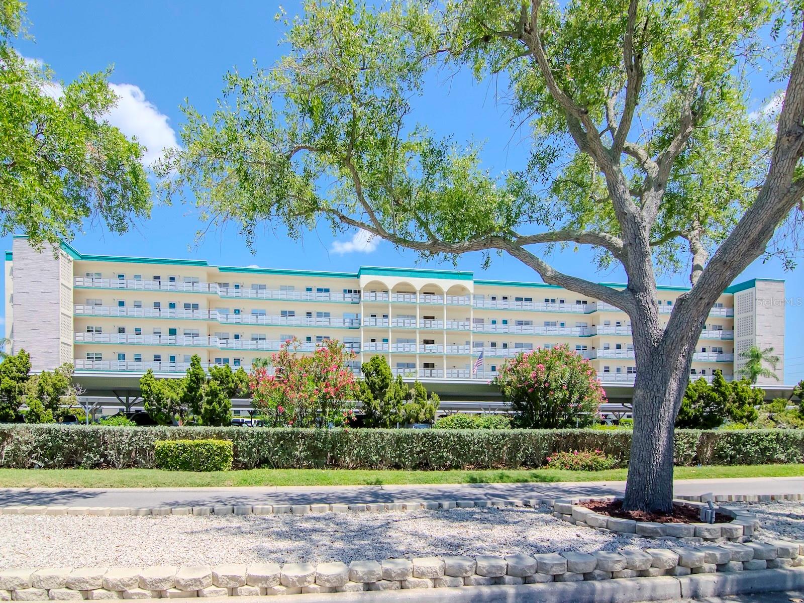NEW LOWER PRICE! 1ST FLOOR 1 BEDROOM, 1 BATH WITH PATIO JUST STEPS AWAY FROM POOL! UNIT HAD NO FLOODING OR DAMAGE IN THE PAST STORMS - Experience luxury living in this stunning large 1 Bedroom, 1 Bathroom Condo in the sought-after Jamison Building at Town Shores. This Condo features Crown Molding throughout, Stainless Steel appliances, newer countertops and the Bathroom has a walk-in shower with beautiful tile work. The Florida Room adds additional space and charm to the already amazing layout. The Florida Room door steps outside to your own patio space, perfect for relaxing or entertaining guests. In addition, Condo comes with a Covered Parking spot to help protect your vehicle. Plus, the newer Pool is just steps away, you'll have easy access to a refreshing dip whenever you desire. Town Shores has many amenities including a clubhouse that provides a welcoming space for social gatherings and events, while the fitness center caters to those looking to stay active and fit. Sports enthusiasts will delight in the pickleball courts, tennis courts, bocce ball facilities, perfect for friendly competitions and recreational fun. Additionally, residents can look forward to a calendar full of engaging events to foster a sense of community and belonging. Located near the vibrant Historic Waterfront Arts District of Gulfport, residents are also treated to a diverse array of shopping and dining options, adding to the allure of this exceptional living environment. Condo comes furnished (except the paintings and artwork on the walls). Don't miss out on this incredible opportunity to call this gorgeous Condo your New Home