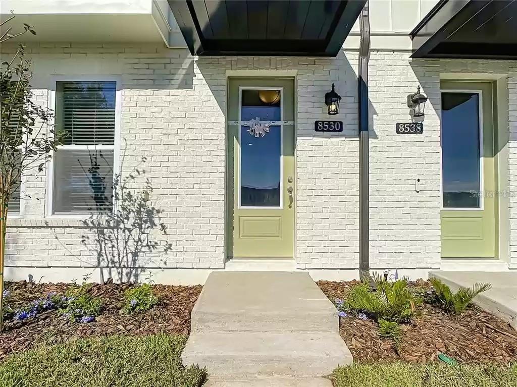 Welcome to this elegant three bedrooms, three and half bathroom townhome. With it's open floor plan, this home is ready for it's new occupants! The house features a fully upgraded kitchen complete with the highest Kitchen Aid package, an oversized island, high-end cabinets, fully upgraded bathrooms, and two master bedrooms on the ground floor and another one on the second floor. the house comes with a great room design on the second story with a plank floored living area overlooking the kitchen and opening up to the dining room and private balcony. Conveniently situated near major highways, 417, 528, turnpike, and Orlando International Airport. Close proximity to Medical City, including UCF Medical School, Sanford- Burnham Institute, Veterans Affairs Hospital, Nemours Hospital, MD Anderson Cancer Center, and Lake Nona Country Club. This incredible house is nestled in the heart of the most welcoming community of Laureate Park at Lake Nona offering a state-of-the-art aquatic area, fitness center, community gardens, dog park, playgrounds, walking/biking trails, cable, internet service, and a Lake House event venue, Located in a few minutes from A-Class schools, Award-Winning Hospitals, shopping, dining, golf courses, this magnificent home is ready for its next resident! Call now and schedule your appointment!