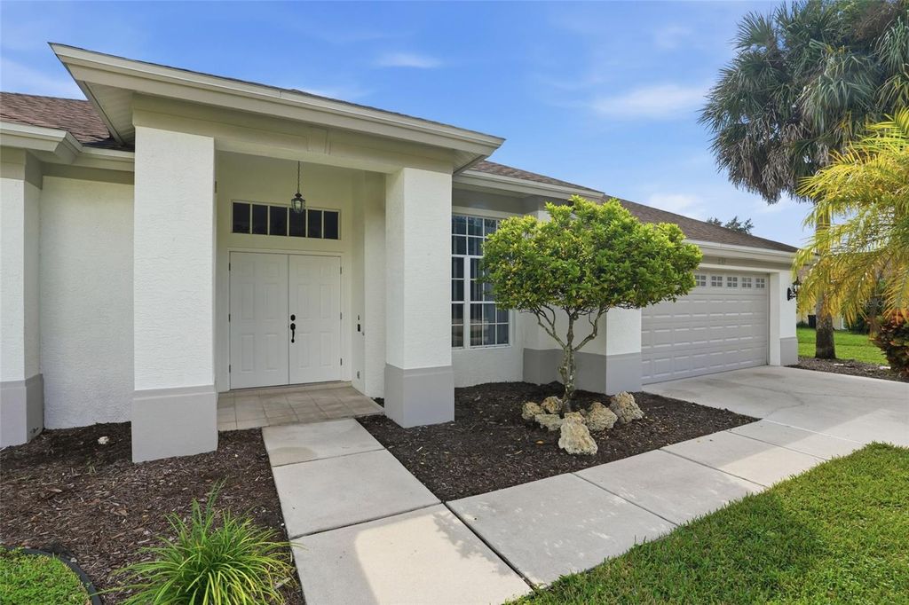 Photo of 571 Chamonix Avenue S, Lehigh Acres, FL 33974 (MLS # O6393124)