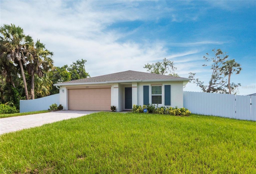 Photo of 2554 Lakeshore Circle, Port Charlotte, FL 33952 (MLS # O6330024)