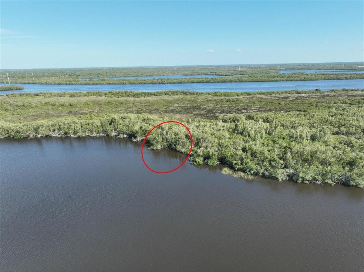WATERFRONT property with direct access to the Gulf of Mexico. Enjoy your own a one of a kind private piece of paradise. Take your boat to restaurants, shopping and great fishing. Not in scrub jay zone per Charlotte. ES zoning allow for the following per zoning website - (a)Intent. The purpose and intent of this district is to preserve and protect land and water areas which have ecological, hydrological, or physiographic importance to the public at large. It is intended to preserve and protect open spaces, park lands, wilderness areas, marshlands, watersheds and water recharge areas, scenic areas, beaches, and native flora and fauna. It is intended to allow limited public or private recreational and educational uses and their incidental accessory uses and structures. -Permitted uses and structures (P):(1) Fish and wildlife management area, nature preserve.(2) Gamelands, public and private.(3) Manufactured home (DCA), minimum requirement is one hundred fifty (150) miles per hour exposure C.(4) Outdoor educational facility.(5) Park, public or not-for-profit.(6) Single-family detached. Detached single-family homes may or may not have a guest suite that is structurally attached with or without cooking facilities.(7) Water conservation areas, reservoirs and control structures, drainage systems and water wells.(c) Permitted accessory uses and structures: Uses and structures which are customarily accessory and clearly incidental to permitted and conditional uses and structures are permitted in this district, including, but not limited to:(1) Boat lifts and boat ramps.(2) Carports, garages, and storage structures. a. Detached accessory structures greater than two hundred fifty (250) square feet in area shall be compatible in appearance with the primary residence, at a minimum, materials and color shall be compatible with the primary residence. b. The total footprint of all detached accessory structures shall not exceed ten (10) percent of the parcel size or one thousand (1,000) square feet, whichever is greater. c. Construction trailers and cargo containers are prohibited.(3) Fences or walls which may be permitted prior to the principal uses and structures.(4) Guest suite, detached, consisting of living and sanitary facilities only. Cooking facilities shall not be permitted in a guest suite. It must meet all applicable development standards set forth in the zoning district(5) Keeping of pets excluding animal breeding, boarding and training.(6) Noncommercial boat docks may be permitted prior to the principal uses and structures.(7) Swimming pools, tennis court or other similar noncommercial recreational uses and structures. Listing agent is the owner of the selling LLC. Lot next door also for sale! (LOT 8&9)