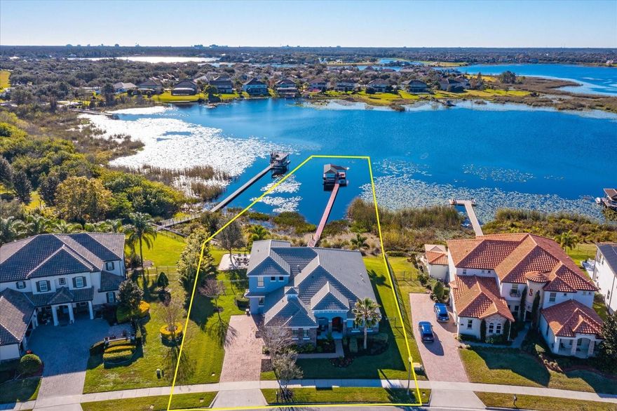 .....LOCATION!  LOCATION!  LOCATION!.....LAKE HOME!.....PRIVATE DOCK!.....SALTWATER POOL!.....PRIMARY BEDROOM on MAIN!!!!!.....
Gorgeous 5 bedroom. 4.5 bath home on Lake Hancock located in Hamlin Town Center. Upon entering, the home welcomes you with a bright, OPEN-CONCEPT design that seamlessly connects the main living areas, creating an ideal flow for entertaining and everyday  living.  Stunning LAKE VIEWS can be enjoyed from the gourmet kitchen, main level primary suite, additional bedroom and great room.  The JUNIOT SUITE would make a wonderful mother in law suite.  The UPPER LEVEL features a spacious BONUS ROOM ideal for media/game/play/home gym or secondary living area; along with FULL BATH and BEDROOM, providing flexibility and privacy away from the main living spaces.  Step outside to a massive RESORT STYLE OUTDOOR LIVING AREA making it your personal oasis for both relaxation or entertaining.  The expansive PAVER DECK leads to a pristine heated saltwater pool and spa.  Your private dock offers the perfect setting to enjouy fishing, sunsets, and nightly Disney fireworks from the comfort of home.  LAKE HANCOCK is renewed fortis exceptional recreational opportunities, making it ideal for boating enthusiasts and avid anglers alike.  The lake is well known for its excellent fishing, canoeing, paddle boarding, water skiing and wake sports.  The lakes size and depth also accommodate seaplane activity.  The COMMUNITY features multiple playgrounds, tennis courts, basketball, pools, fitness centers, arcade, clubhouse, dog park, business center and CABLE/INTERNET included in HOA DUES.....Located in one of Central Florida's most sought after areas-HAMLIN TOWN CENTER, the vibrant heart of the HORIZON WEST community. The NEIGHBORHOOD offers sidewalks. paved WAKING/BIKING trails connecting to everything you need. Close walk to grocery store, dining, shopping, Cinepolis, POPSTROKE (Tiger Woods designed Putt Putt),  Restaurant/Ice Cream Parlor/kids Playground), Urban Air Adventure & Trampoline Park.  Convenient access to SR429!  ***All information deemed reliable but not guaranteed and should be independently verified by the buyer***