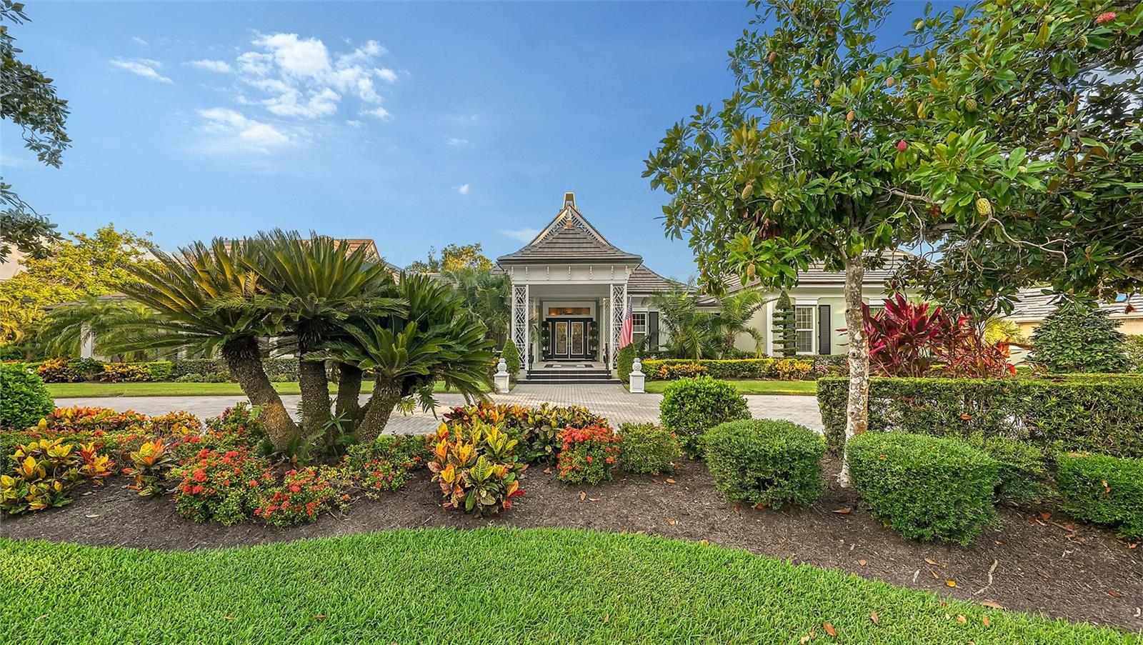 Incredible, spectacular, stunning, are just a few of the words that you will utter as you walk through this magnificently updated and remodeled 3 bedroom, 4 bath Bo MacEwen designed home in The Oaks Bayside. Located on a cul-de-sac street and situated on 1.5 gorgeous tree covered lots facing south and overlooking the lake, this home offers everything anyone could want. The large, covered lanai area is adjacent to the open pool area, complete with waterfall, summer kitchen and beautiful landscape lighting, making the outside space perfect for entertaining. Inside you will find a combination of wood and stone flooring, large rooms with high ceilings, incredible crown moldings and real wainscoting. The huge open kitchen is a chef’s delight featuring only the best appliances like the Diva Induction cooktop, Thermador Refrigerator, Dacor warming drawer, Thermador double ovens and multiple dishwashers by Mele' and Fisher/Pakel. If you are able to tear yourself from the kitchen you will find incredible touches throughout the rest of the house such as hand-carved stone gas fireplaces, and a 250 bottle wine cabinet, and large bedrooms all with adjoining baths. A newer roof, Ace Duraflo lined pipes, full hurricane protection, and an all brand new HVAC system give you peace of mind that the mechanics of the house are solid. There is so much more, including new retractable screens and custom garage floor that you truly must see this home to appreciate all it has to offer Make your appointment today...you will be impressed by the WOW factor; this is a true Sarasota dream come true! This magnificent home is located behind the secure gates of Oaks Bayside. The Bayside is on the west side of Tamiami Trail and is surrounded on three sides by water. Residents have use of the community dock and enjoy a quiet lifestyle among the 200 acres of lush natural beauty. The Oaks, Sarasota’s finest golf and country club has 2 championship golf courses, 12 HarTru tennis courts (4 lighted), croquet court and pickle ball courts, fine dining and an abundance of social activities; club membership is required with homeownership.