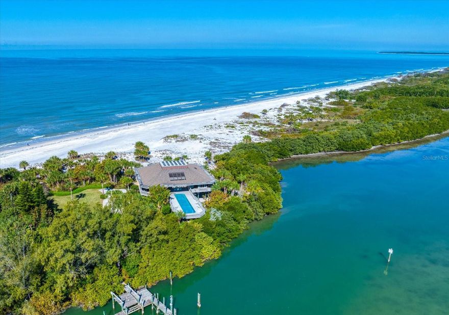 An opportunity of this caliber rarely presents itself on the west coast of Florida, 1198 Mandalay Point represents extraordinary value for one of the state's most exclusive waterfront properties. Set on 42.57 acres at the secluded northern tip of Clearwater Beach, this remarkable beach to bay property is the last and only private residence of its kind. Bordered on the north by the untouched beauty of Caladesi Island State Park and accessible by a private road, the estate offers unmatched tranquility with miles of pristine beach. For the yachting enthusiasts, a rare deep-water dock accommodates vessels up to 80 feet, providing direct access to the Intracoastal Waterway and the Gulf of America for effortless cruising, fishing and island hopping. This is more than a home - it is a private sanctuary, a lifestyle investment, and a generational legacy. With its protected setting, private entrance, and rare beach-to-bay frontage, 1198 Mandalay Point stands alone as the crown jewel of Clearwater Beach real estate.
The 3,434 square foot residence is elevated 20 feet above sea level to showcase panoramic Gulf to Bay views. Inside, soaring 30 plus foot ceilings crown an atrium with a heated lap pool, overlooking the lush preserves of the south end of Caladesi Island, Malone and Moonshine Islands. Each room frames views of sunrises, sunsets and importantly - 360 degrees of palm trees, sandy beaches, the gulf and the bay.
Whether entertaining guests or enjoying quiet moments, this home provides an unparalleled living experience. From its tranquil setting and proximity to Tampa International Airport to its world-class dockage and breathtaking natural beauty, 1198 Mandalay Point offers everything you need to enjoy the best of Florida living. An exceptional offering.
