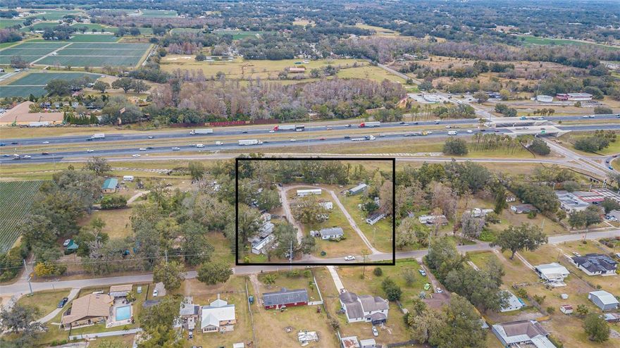 LOCATION, LOCATION, LOCATION! This prime 2.5-acre property boasts unbeatable 1-4 frontage, about 350 feet off of exit
ramp, ensuring exceptional visibility and accessibility to over 41,000 vehicles daily. Situated in Plant City, Florida, it
offers proximity to major metropolitan areas, making it ideal for businesses like retail outlets, professional offices,
places of worship, mobile parks, schools, and more. With commercial zoning and limitless potential, this property
presents an excellent opportunity for growth and investment in one of Florida's most dynamic markets. This sale
includes a travel trailer, along with electricity, septic, and well hookups, making it ideal for an on-site office and added
convenience. Additionally, there are existing trailers (TOH) that generate approximately $3,500 in monthly income.
The trailers can either remain on the property or be removed, depending on the terms negotiated with an offer.
Plant City is experiencing rapid expansion, with its population projected to grow by more than double by 2050. Ideally
situated centrally between Downtown Tampa and Orlando, and within easy reach of Tampa International Airport
making travel a breeze for the frequent flyer. This property boasts a prime location for innovative investors. Contact me
today to schedule a viewing and unlock the endless possibilities of this exceptional commercial property.