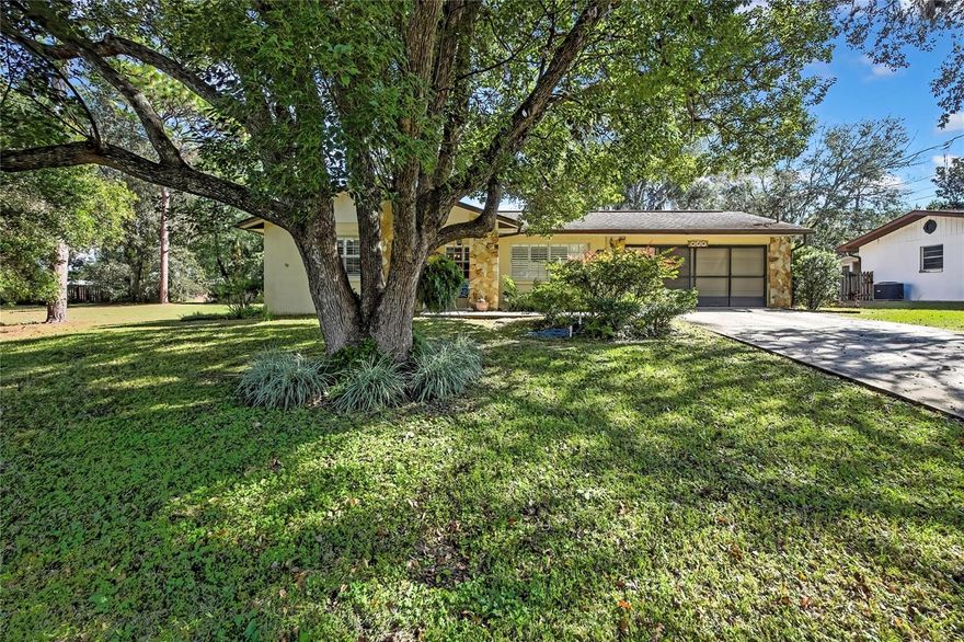 NO HOA! This CHARMING 2-bedroom, 2-bath home offers the PERFECT blend of rural tranquility and city convenience. Ideally located just minutes from downtown and beautiful local lakes—perfect for boating, fishing, and outdoor adventures—yet only an hour from Florida’s world-famous beaches and theme parks. Inside, you’ll find a SPACIOUS family room with a stunning STONE wood burning fireplace, a formal dining room, and a WELL-designed kitchen with a versatile bonus area—ideal for a home office, craft room, or additional living space. The primary suite features a HUGE walk-in closet and a separate vanity area for added convenience. Step outside to your BEAUTIFULLY landscaped PRIVATE backyard, complete with a courtyard and covered screened lanai—perfect for enjoying your morning coffee or relaxing evenings. With plenty of storage space this home offers comfort, charm, and endless possibilities. Schedule your tour today!