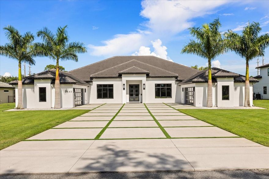 This custom-built, single-story masterpiece sits on just over an acre of manicured grounds in the heart of Lake Mary, offering an exceptional
blend of modern elegance and everyday comfort. A 4-car garage with custom showroom floors and a turf-accented driveway sets the tone for the sophistication within. Inside, 48"x48" tile floors, level 5 drywall, soaring ceilings, and an open great room design create a dramatic yet inviting space for both grand entertaining and intimate gatherings. The show-stopping kitchen is a chef’s dream, featuring double quartz
waterfall islands, top-of-the-line appliances including a gas cooktop and wine refrigerator, two dishwashers, and a hidden pantry. A glass enclosed wine display adds a striking focal point, while corner-sliding glass doors blur the line between indoor and outdoor living. The primary suite is a true private retreat, offering direct access to the back patio, a large custom walk-in closet, and a spa-inspired en-suite with an oversized walk-in shower featuring dual shower heads, and a double vanity. With five bedrooms—including one currently used as a sophisticated home office—and a large bonus/media room, this home offers remarkable flexibility. Automatic window shades, a security-ready office setup, two secondary bedrooms with private en suites, and an oversized “Costco” closet with a well-appointed laundry room add practical luxury. Step outside to an expansive lanai with hurricane-rated motorized screens, an outdoor kitchen, and a resort-style saltwater pool with basketball hoop and turf-lined deck, all framed by lush palm and bamboo landscaping for ultimate privacy. Located minutes from A-rated schools, upscale shopping, and fine dining, this home is offered fully furnished with over $500,000 in high-end furniture, artwork, and electronics—ready for you to move in and begin living the Lake Mary lifestyle at its finest.