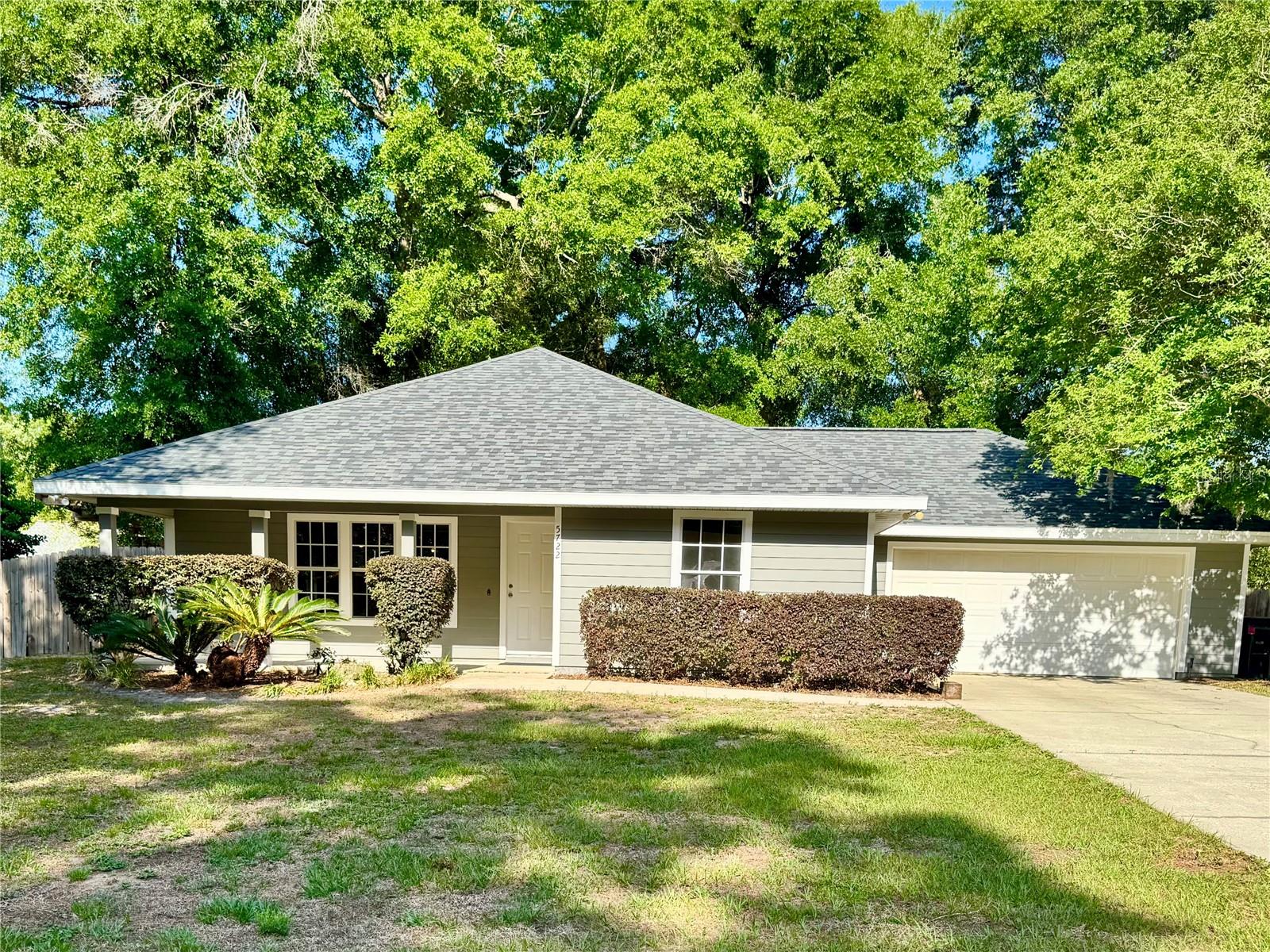 Located in the desirable Hickory Forest community, this beautifully maintained 4-bedroom, 2-bathroom home offers 1,498 square feet of thoughtfully designed living space. Built in 2006 with durable Hardiboard siding and a new roof installed in 2024, the home combines quality construction with modern upgrades for worry-free living. The interior features brand-new laminate flooring throughout the main living areas, an open layout ideal for entertaining, and a spacious owner’s suite complete with a walk-in closet and a walk-in shower. Additional highlights include an indoor laundry room and a 2-car garage equipped with an electric vehicle charger. Step outside to enjoy the outdoor wooden deck and grilling area, perfect for hosting gatherings or relaxing evenings. Residents of Hickory Forest enjoy access to a community pool, clubhouse, and playground. Conveniently located less than a mile from Publix, CVS, restaurants, and shopping, with quick access to Shands Hospital, the University of Florida, the VA, and HCA healthcare facilities, this home offers comfort, convenience, and community all in one.