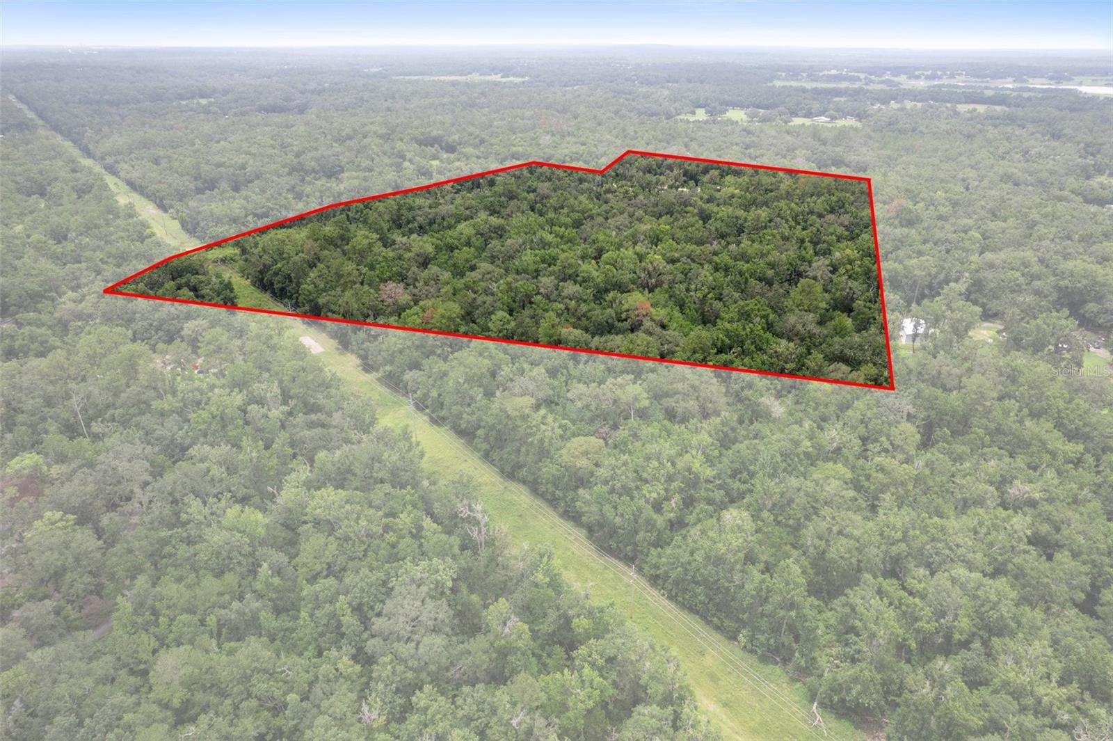 Welcome to 6440 Cedar Ln—formerly home to FLG X Adventures—a one-of-a-kind commercial opportunity nestled in the natural beauty of Brooksville. Spanning an impressive 36.5 acres, this property was once a thriving treetop zipline and adventure park, drawing thrill-seekers from across the region.
The site includes multiple zipline and ropes courses, a warehouse, ticketing center, and restroom facilities—all purpose-built for outdoor recreation and visitor experiences. While some towers and course elements sustained damage from a recent hurricane, much of the infrastructure remains, offering a solid foundation for redevelopment.
Perfect for investors, developers, or visionaries in eco-tourism and outdoor recreation, this vast acreage offers endless possibilities—revive the adventure park, create a glamping resort, build an event venue, or design an outdoor retreat center. The combination of established amenities and natural surroundings makes this a rare gem ready for transformation.
Don't miss your chance to reimagine and reinvigorate this iconic 36.5-acre property into the next must-visit Florida destination.