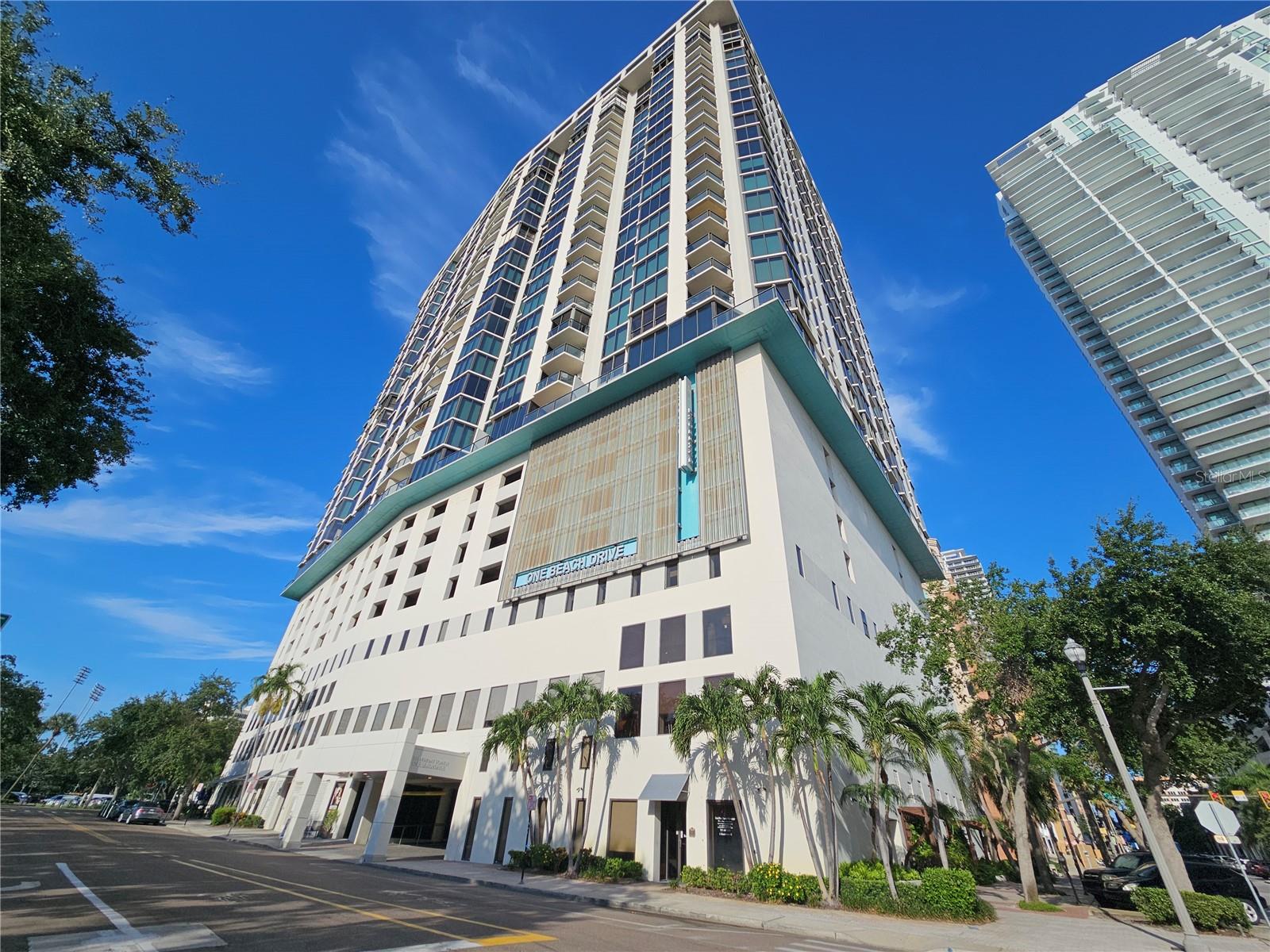 Luxury condo in a prime Downtown St. Petersburg location, offering stunning city views and access to a rooftop pool with full panoramic views. This spacious unit features an open floor plan with two large bedroom suites, each with an ensuite bath and walk-in closet. A versatile bonus room is perfect for a home office or den. Enjoy fresh air and beautiful views from your private balcony with sliding glass doors. Just steps from marinas, waterfront parks, restaurants, shops, and the vibrant Beach Drive, Bayfront Tower delivers full-service living with 24-hour concierge, valet service, and covered garage parking. Exceptional amenities on the 28th and 29th floors include a fitness center, library, lounge, heated pool, outdoor kitchen with grills, and a rooftop walking track with breathtaking views in every direction. This pet-friendly residence includes parking space #185 and a climate-controlled storage unit on the same floor. A rare opportunity to own a stylish downtown address with unmatched convenience and amenities.