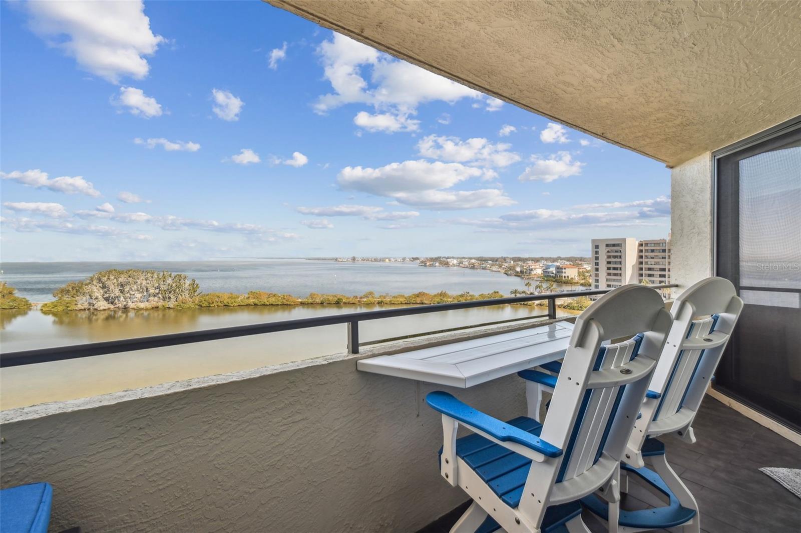 1 bedroom / 1 bath furnished unit with private terrace at Gulf Island Beach & Tennis Club II. Remodeled and furnished seventh-floor unit has hurricane impact sliders.
Plank tile flooring throughout, crown molding, barn doors, real laundry room with stackable washer and dryer, kitchen pantry has a built-in spice rack and storage, granite countertops, stainless steel appliances, dual vanity sink in the bathroom, heated towel bar & toilet, and walk in shower. The bedroom not only offers beautiful views from the balcony but has AMPLE STORAGE with a custom built-in closet system and separate wardrobe cabinet. Enjoy your morning coffee or evening cocktails overlooking the lagoon on your balcony or 700 sq foot terrace, perfect for entertaining. The Gulf Island Beach and Tennis Club Complex is a resort-style community offering a private beach, heated swimming pool just steps from the unit, barbecue facilities, tennis courts, and clubhouse. Community Features: 24hr Guard, Heated Olympic sized pool, clubhouse, game room and fitness center, tennis/pickleball courts, private beach, lagoon, BBQ areas & nature trail!
Gulf Island Beach & Tennis Club is truly the hidden GEM of Pasco County, this community offers residents and owners an active waterfront lifestyle.
Rates vary depending on time of year and length of stay. Call for availability and current pricing.