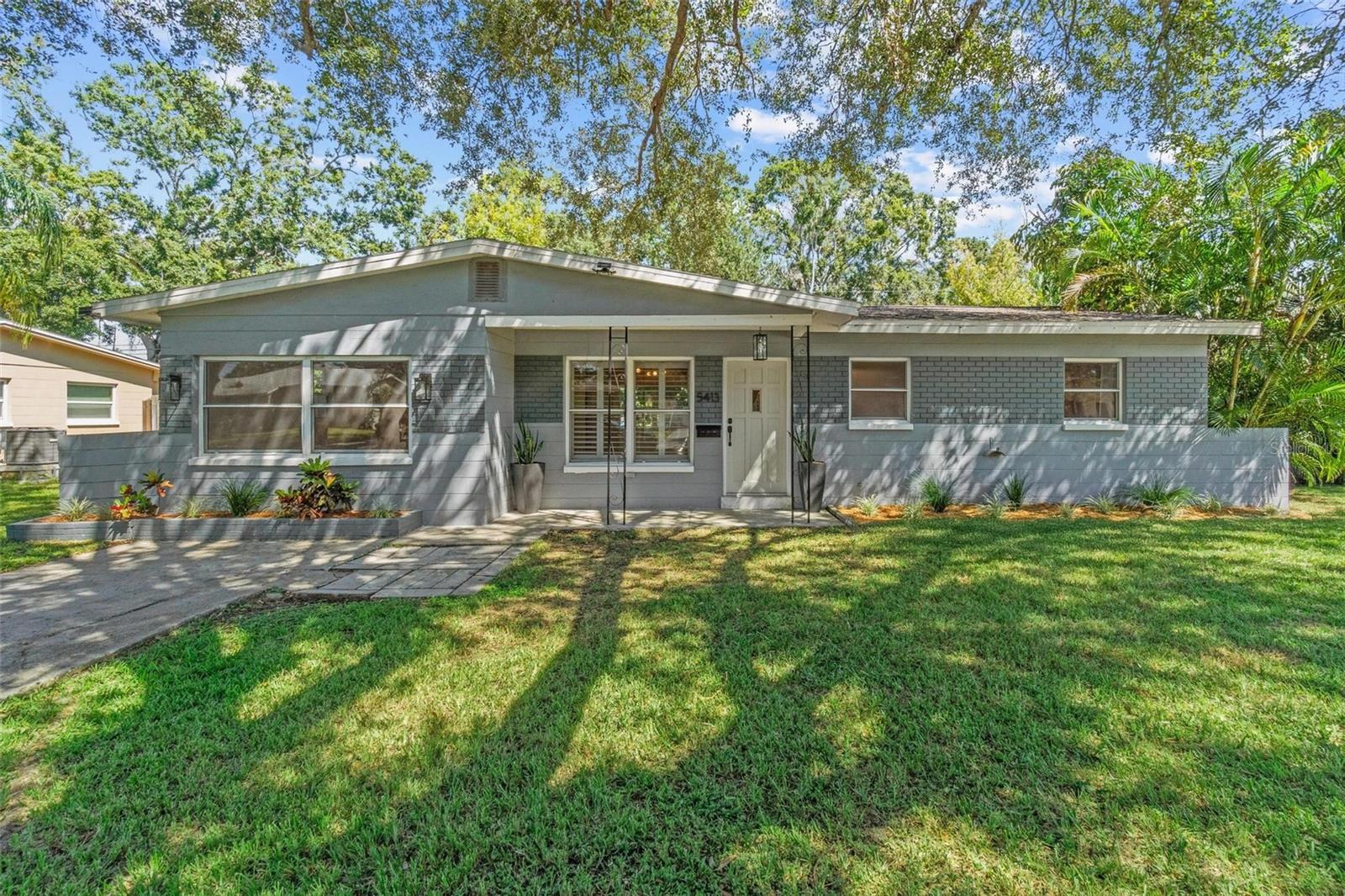 Welcome to your dream home in the heart of St. Pete! This beautifully updated 4-bedroom, 2-bath residence blends timeless charm with modern convenience. Inside, you’ll find brand-new luxury vinyl floors and upgraded doors throughout, creating a fresh, elevated feel. The bright Florida sunroom is ideal for morning coffee, while both the covered front and back patios expand your living space outdoors. The spacious fenced backyard offers privacy, sunshine, and mature trees, and two large sheds provide plenty of room for storage. The kitchen features solid stone countertops and stainless steel appliances, perfect for entertaining or family meals. The primary suite boasts a walk-in shower and a built in closet, while the guest bath includes a full tub with modern subway tile. All bedrooms have great closets, including an oversized walk-in closet in the fourth bedroom. Additional highlights include a brand-new state-of-the-art roof (2022) for energy efficiency, an inside laundry with commercial-grade washer & dryer, and the peace of mind of being in Flood Zone X. All this in a quiet, convenient neighborhood just 15 minutes from downtown St. Pete and St. Pete Beach, and only minutes to shopping, dining, and stores like Publix, Macy's, Wawa, and more. This home is zoned for Northwest Elementary, Tyrone Middle, and St. Petersburg High School. Each is just minutes away, making school drop-offs and extracurricular activities a breeze. Families will love the convenience of being close to education, while still enjoying the comfort of this beautiful neighborhood.
This move-in-ready gem has it all—schedule your showing today!