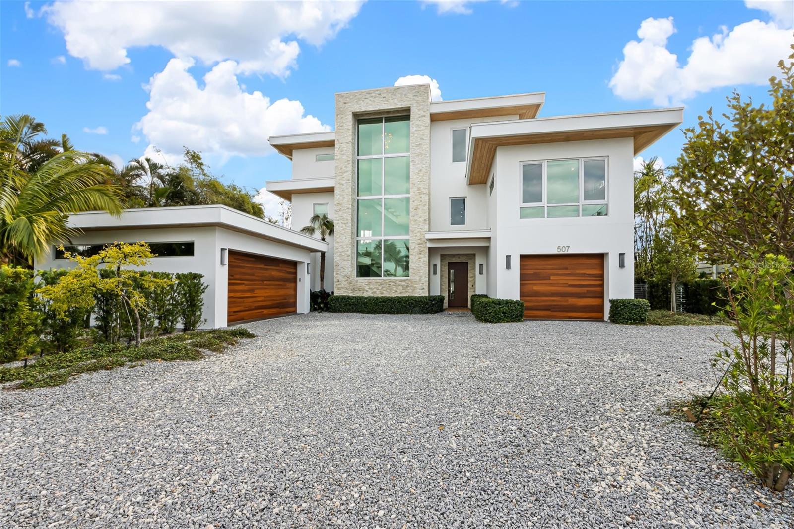 Rare opportunity to own an amazing Bimini Bay custom-designed organic modern home in Holmes Beach on Anna Maria Island! This 5 bedroom en suite bathroom home with 2 half baths was built in 2021 by Mason Martin Builders and only used twice a month by owners only. Completely furnished by Restoration Hardware including all of the beautiful lighting. Located on a quiet, cul de sac street in Holmes Beach in a 30 day minimum zone for renting. Featuring an open floor plan with vaulted ceilings and french oak engineered hardwood flooring throughout with gorgeous large format tile in each bathroom. The large chef’s kitchen has Wolf appliances, a 10 foot concrete waterfall island, and a bookmatched backsplash to the ceiling. The kitchen is open to the family room with floor to ceiling glass, a fireplace, wet bar, wine cooler and an ice maker. There is a large, walk in laundry room plus pantry right off the kitchen. There are two en suite bedrooms on the main floor and three en suite bedrooms on the second floor as well as a media room with a bar and beverage cooler. First and second floors have large balconies that overlook the bay. This gorgeous home also includes a 3 car garage, elevator, home gym, impact windows and doors and speakers inside and out. Your private backyard oasis on Bimini Bay has complete privacy without neighbors across the canal and endless views of the beautiful wildlife. Enjoy the oversized pool/spa and water features. The large outdoor living area was designed to entertain with a TV, outdoor dining, and multiple seating areas and a custom fire feature. For the boat lovers, there is a large Ipe wood dock, 10,000 lb. boat lift, a fish cleaning table, and an outdoor shower! Luxury, high end homes in this area don’t come around often, schedule your private showing today!