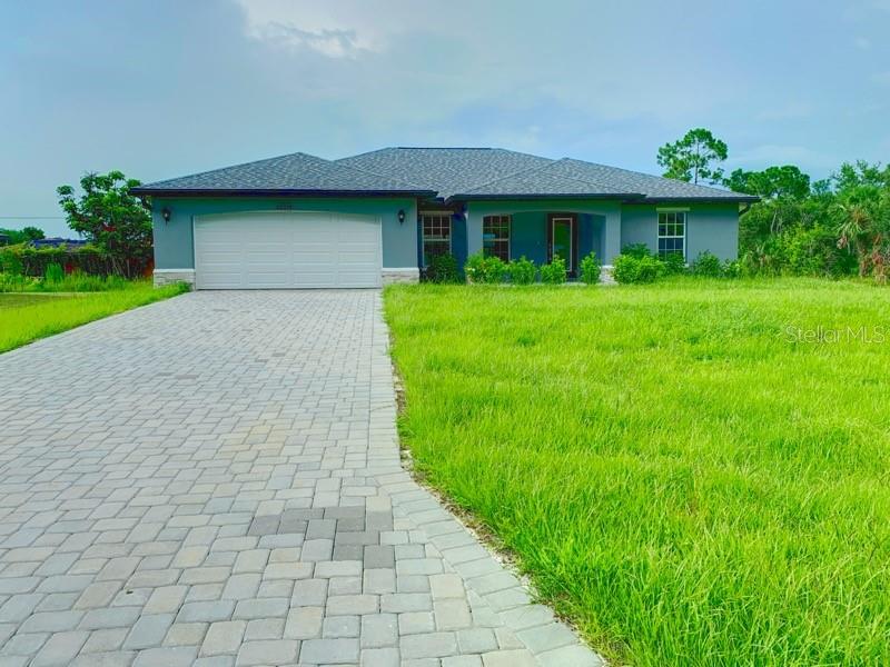 Don’t miss the chance to rent this stunning 2025 NEW CONSTRUCTION four (4)-bedroom home in Port Charlotte! Start your day with a cup of coffee—or unwind in the evening with a cocktail—under the spacious, covered front porch designed for comfort and relaxation. Inside, you’ll find over 1,800 sq ft of modern living space with an open-concept layout, perfect for the Florida lifestyle. The expansive great room and dining area are ideal for entertaining, enhanced by a wall of sliding glass doors that flood the space with natural light. The open kitchen features solid granite countertops, a large island perfect for cooking or creative projects, and stainless steel appliances—all blending style with functionality. The split-bedroom design offers privacy for everyone. The master suite is a peaceful retreat with two walk-in closets, a spacious bathroom with dual sinks, a tiled walk-in shower, and a large linen closet. Three additional bedrooms on the opposite side of the home provide space for family, guests, or a home office. Additional features include a full-lite impact-resistant glass front door, hurricane-rated windows and doors, granite countertops in both kitchen and baths, and gorgeous curb appeal with a paver driveway on a desirable corner lot.
