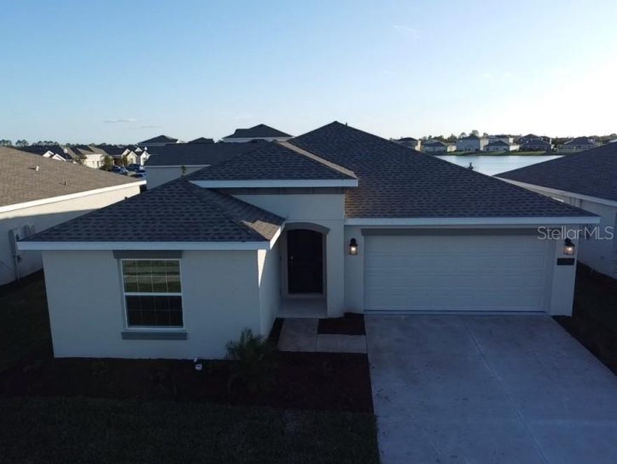 Like NEW. Solar powered single family home. Be the  lucky family to live in this wonderful property that offers, High end finishes, open floor plan, gorgeous tile floors and standard carpet in bedrooms. kitchen features quartz counter tops , white cabinets, stainless steel appliances and a stunning center island which overlooks a large dining room, a family room. Laundry closet with brand new washer and dryer. Magnificent pond view and tons of more upgrades. This beautiful home is nestled in the heart of St. Cloud newest community featuring resort style swimming pool, cabana, playground, dog park and hiking trails. Conveniently located just minutes from the Florida turnpike and top rated schools.