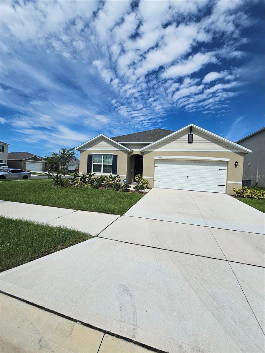 Beautiful move-in ready home with an open-concept design. The modern kitchen features a center island and overlooks the spacious family dining area, ideal for gatherings. The master suite includes a large bedroom, a bathroom with dual sinks, and a large walk-in closet. Three additional bedrooms and a full bathroom make this home the ideal choice for a large family. The two-car garage offers convenience and additional storage space. The home is equipped with quality finishes, porcelain tile floors, window shutters, a security system including modern appliances, and solid surface countertops throughout. Located in charming Haines City, Florida, with easy access to Highways 27 and 17, enjoy nearby shopping, dining, and entertainment options, plus outdoor activities at the Lake Eva Aquatic Center, local parks, and beautiful Lake Marion.