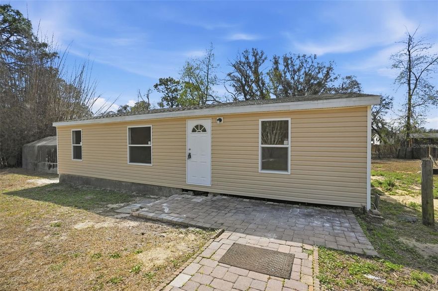 TOTALLY REMODELED and ready for its new owner. This 3/2 mobile home has been tastefully updated with new luxury vinyl flooring throughout. Freshly painted. BRAND NEW kitchen cabinets, stone counters and new stainless steel appliances. Roof 2023. HVAC 2025. BRAND NEW windows and siding. All new plumbing and electrical. Situated on a little more than a half-acre there's NO FLOOD, NO HOA, NO DEED RESTRICTIONS here. BRAND NEW well tank and pump. Both bathrooms have been updated to tile showers with new vanities. Inside laundry. Large, detached, metal shed. New fans and fixtures throughout. Tucked away in a private setting but close to the Suncoast Parkway, Lecanto Highway and Grover Cleveland Blvd; making getting around super easy! Make an appointment to see this place today!