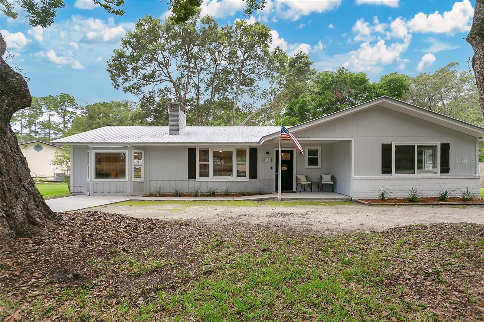 Captivating move-in ready home with NO HOA and room for all your toys! This updated 3 bed, 2 bath home sits on over half an acre with a metal roof (2016), brand new 3-ton Carrier HVAC with transferable warranty, new septic tank (2023), and full replumb completed in (2016)! All the big-ticket items are already taken care of for you!
Inside, you’ll find fresh paint, updated flooring, and a modern kitchen with quartz countertops, stainless steel appliances, and large pantry. The master bathroom has been fully updated, and the wood-burning fireplace in the living room adds charm youve been looking for. There's even a dining room with a bay window that brings in natural light and is the perfect spot for morning coffee or family dinners.
A perfect home to enjoy the outdoors with a screened porch, 13’x12’ back patio, 10’x7’ front patio, and an 8’x10’ shed. The huge privacy-fenced backyard features manicured trees, a fire pit perfect for the cool winter evenings, and plenty of space for your RV, boat, jet skis, or more! The house is connected to public city water while also offering a separate well for irrigation purposes a great feature to help keep your yard lush year-round at a lower cost!
Best of all, you're only 15 minutes from historic downtown St. Augustine and its iconic beaches—close enough to soak in the rich history and coastal shorelines, yet far enough to enjoy your own space, privacy, and freedom! With Over 2,000 sq ft under roof, this home has the upgrades, the space, and the freedom you and you've been looking for.