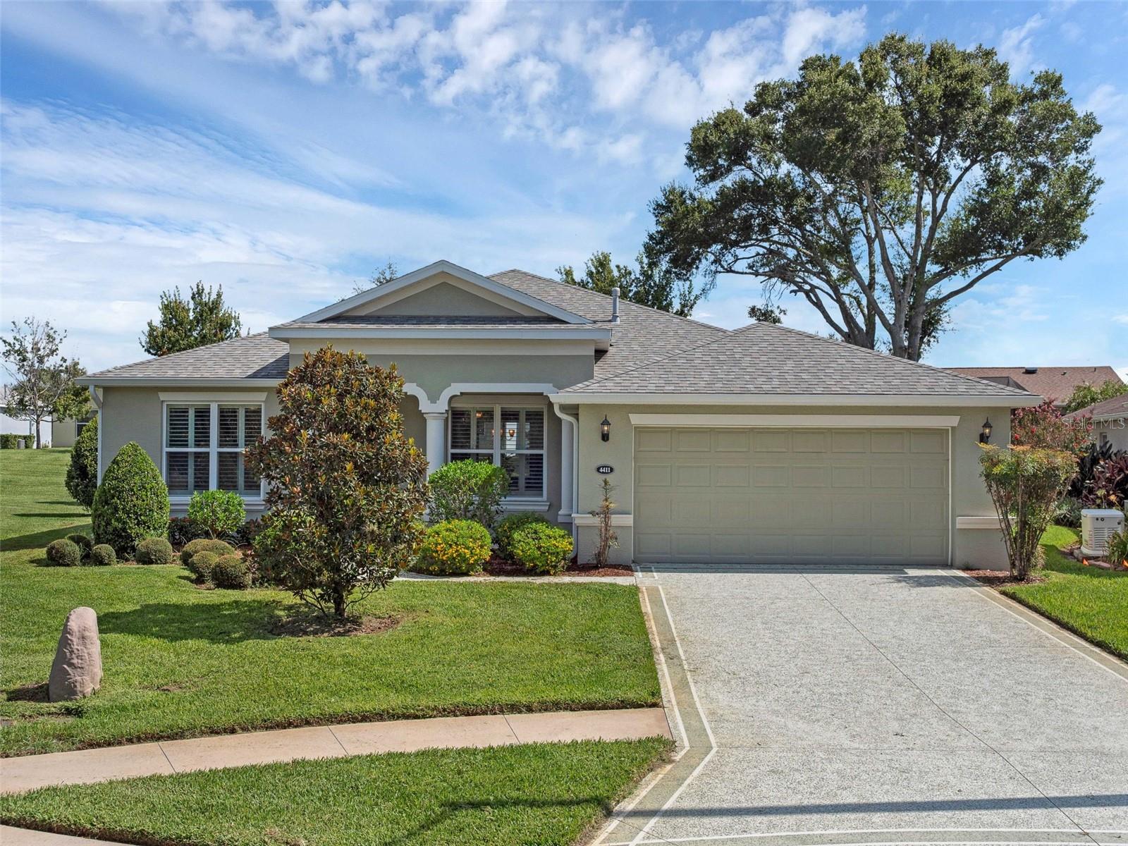 One or more photo(s) has been virtually staged. Our Sabal IV Open Concept Living lends it's owners both formal & casual living along with a spacious inside laundry room, a two-car garage, screened lanai, and transferrable termite bond!  Situated in a quiet cul-de-sac with low maintenance landscaping, great curb appeal, and recently power washed, all you need to do is write the contract!  This split bedroom floor plan allows your guests to have privacy and comfort.  The storage space in this home includes walk-ins, built-ins, attic space, pantry, and linen closets throughout!  The spacious kitchen is graced with granite counters, electric appliances, lower cabinet pull-outs, and a tiled backsplash.  You'll love the luxury vinyl flooring, FLEX ROOM, 2018 appliances, (roof, water heater and HVAC) as well as the large primary en-suite with walk-in Roman Shower, dual vanity with Corian counters, and private water closet.  Our home is being sold partially furnished, professionally cleaned, and ready to move right in!  Arlington Ridge is a 55+, gate golf country club community with beautiful facilities and amenities.  Zero entry & lap pools, jetted hot tub, large community fitness center, Grand Hall, Restaurant, Pub, pro shop, billiards and spa services galore!  You'll love the stadium seating movie theater, library, sidewalks, courts, and the many clubs Arlington Ridge has to offer.  Conveniently close to shopping, medical facilities, MCO, Florida Turnpike, Amusement Parks, and Restaurants!  Call for your tour of Arlington Ridge and this exceptional property today!