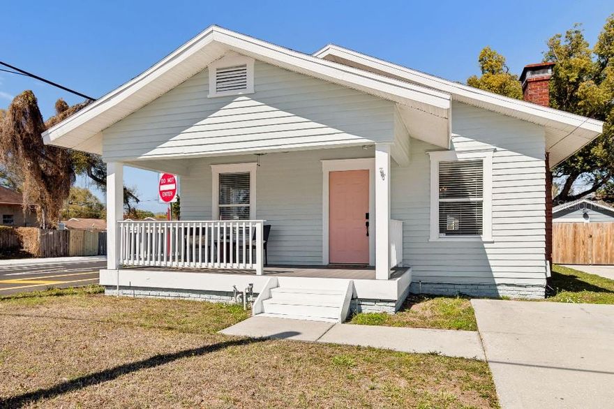 Welcome to this beautifully preserved 1926 Craftsman bungalow in the heart of Seminole Heights. Blending historic charm with modern upgrades, this 2-bedroom, 2-bath home features an inviting front porch, a freshly painted exterior, and beautiful  hardwood floors throughout.

Inside, open living and dining spaces are filled with natural light, accented by wood ceiling beams and a charming decorative fireplace. Elegant chandeliers in the dining room, master bedroom, and guest bath add timeless character. The spacious kitchen flows seamlessly from the dining area and features generous cabinetry along with a large peninsula counter with bar seating, perfect for entertaining.

French doors lead to a large back porch, extending the living space outdoors, where a fully fenced backyard provides room for pets, play, or your own private outdoor retreat. Both bedrooms have been freshly painted. The primary bedroom includes an en-suite bathroom, while the guest bath features a stunning claw-foot tub.

Step outside and experience Seminole Heights, one of Tampa’s most vibrant neighborhoods. Walk to local coffee shops, breweries, and beloved family-owned restaurants. Just minutes away, enjoy game days with the Buccaneers, spring training with the Yankees, and hockey nights cheering on the Tampa Bay Lightning. Explore the Tampa Riverwalk, dine at Michelin-recognized restaurants, visit Armature Works, or commute easily to Tampa Bay’s beautiful beaches, major hospital systems, and top-rated schools.