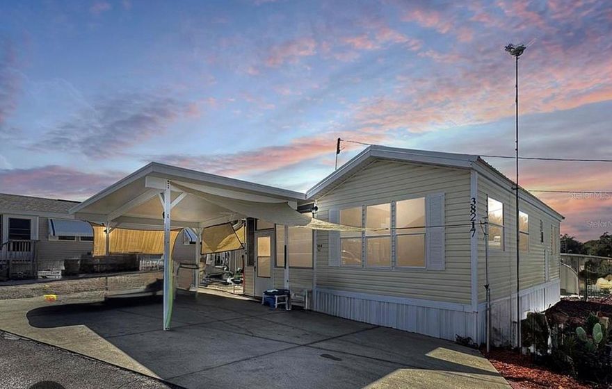 Looking for a place to call your own without the burden of high lot rent? If you’re 55 or older, this fully furnished turnkey 1-bedroom, 1-bath home could be your ideal match. Located in the vibrant Palm Shores RV Resort, this property includes land ownership and offers direct access to Lake Yale—over 4,000 acres perfect for boating and freshwater fishing.

Whether you’re seeking a full-time residence, an affordable vacation retreat, or a smart rental investment, this home checks all the boxes. Inside, you’ll find an efficient living area, a spacious all-weather Florida room for added flexibility, and a large utility room with plenty of storage and laundry space. A covered carport keeps your vehicles protected.

The low co-op fees cover water, sewer, trash, and access to an array of community amenities, including a clubhouse with billiards and card rooms, a heated pool and spa, a boat ramp, fishing station, and boat slips (first-come, first-served).

Don’t miss this rare opportunity to own your own slice of paradise in an active 55+ lakefront community!