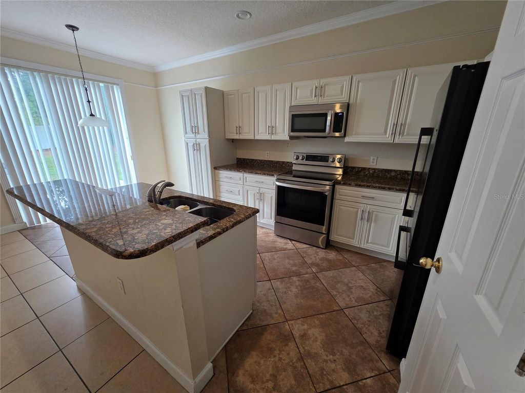 Photo of 830 Neptune Pointe Lane, Kissimmee, FL 34744 (MLS # O6371003)