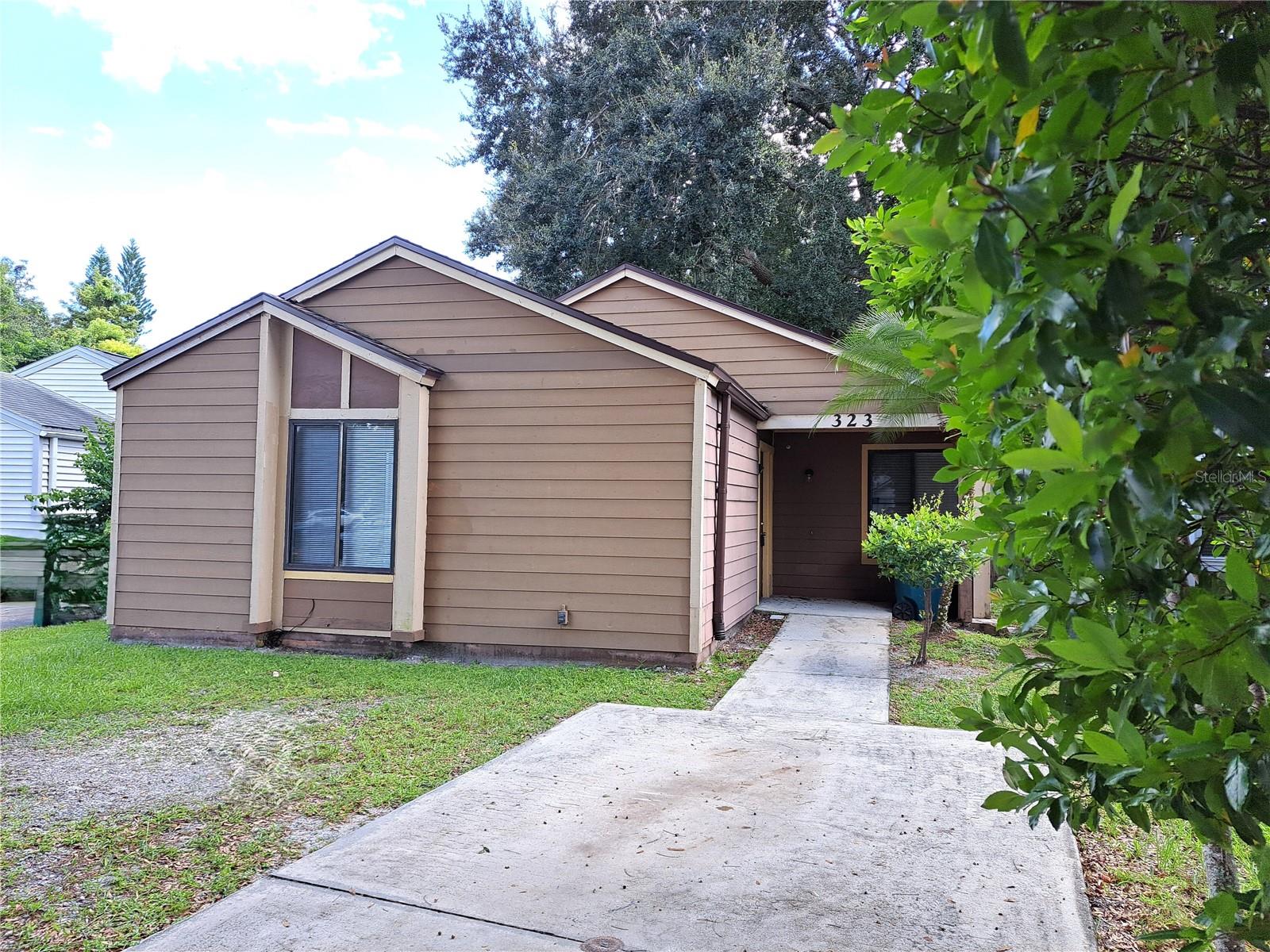 This cozy bungalow-style home has plenty to offer aside from a quiet location with great proximity to parks, shopping and restaurants. The home features New Roof (May 2023); Goodman AC (2023); New interior/exterior neutral paint and carpet. This 3/2 split floorplan gives you plenty of space plus vaulted ceilings and plenty of natural light flow throughout the home. Open kitchen is light and bright and leads outdoors to a large screened patio area overlooking the fenced rear yard. A separate dining area provides a welcoming space for family dinners or festive gatherings. The primary suite features a walk-in closet and a larger vanity with natural skylight and updated shower. The secondary bedrooms are spacious and share a centrally located bathroom with tub/shower. The tranquil screened porch and private backyard is perfect for relaxing or entertaining. This location offers nearby top-rated schools, access to community amenities including a pool, sport courts, playground, and scenic walking trails. Just minutes from Audubon park, Central Winds, dining, shopping, and entertainment.