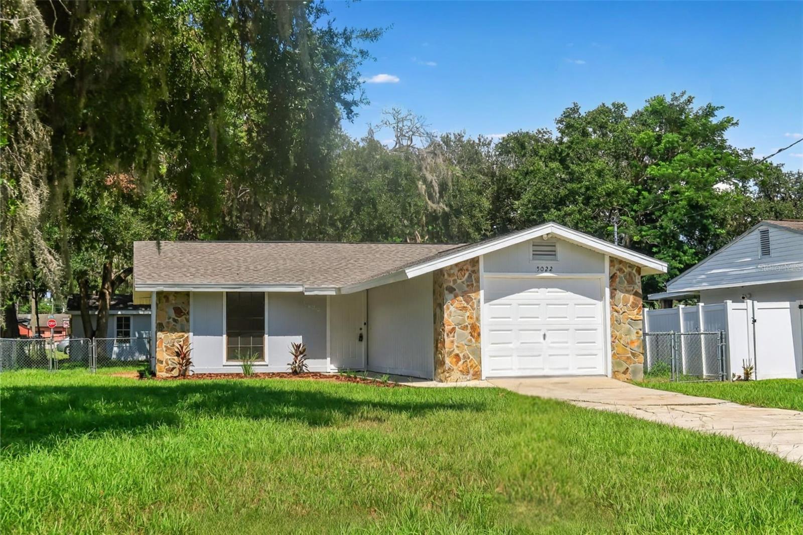 One or more photo(s) has been virtually staged. Welcome to 5022 5th St in Zephyrhills! This 2-bedroom, 1.5-bathroom home offers comfortable living with fresh interior and exterior paint. The spacious kitchen is equipped with a dishwasher, stove, oven, and refrigerator, and opens to the dining area with a cozy fireplace. Enjoy the fully fenced yard with a screened-in porch - great for relaxing. The property also includes an attached garage plus a detached garage/storage shed in the backyard, ideal for lawn equipment or additional storage needs. Washer and dryer hookups are included for added convenience. Located just minutes from local shops, dining, and parks, this home is a great find in the heart of Zephyrhills!
Call Palm Island Realty today to schedule a showing!
Some photos in this listing have been virtually staged to help illustrate the property’s potential. No physical changes have been made to the property.
As part of this month's move-in special, the $350 non-refundable cleaning fee is waived! Prospective tenants are subject to a $75 application fee /applicant and a $150 administrative fee. There is also a $17 monthly asset protection fee. If applicable, pets require a $300 non-refundable fee /pet. Sign a lease this month to take advantage of these limited-time savings!