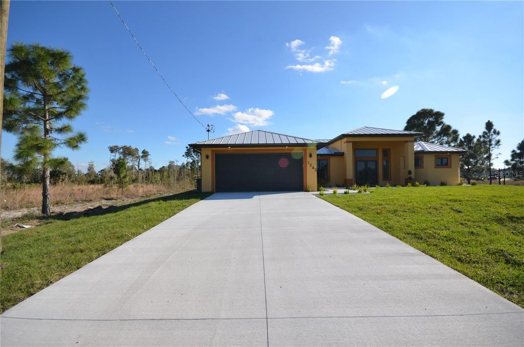 Photo of 1242 Hathor Street E, Lehigh Acres, FL 33974 (MLS # O6343861)