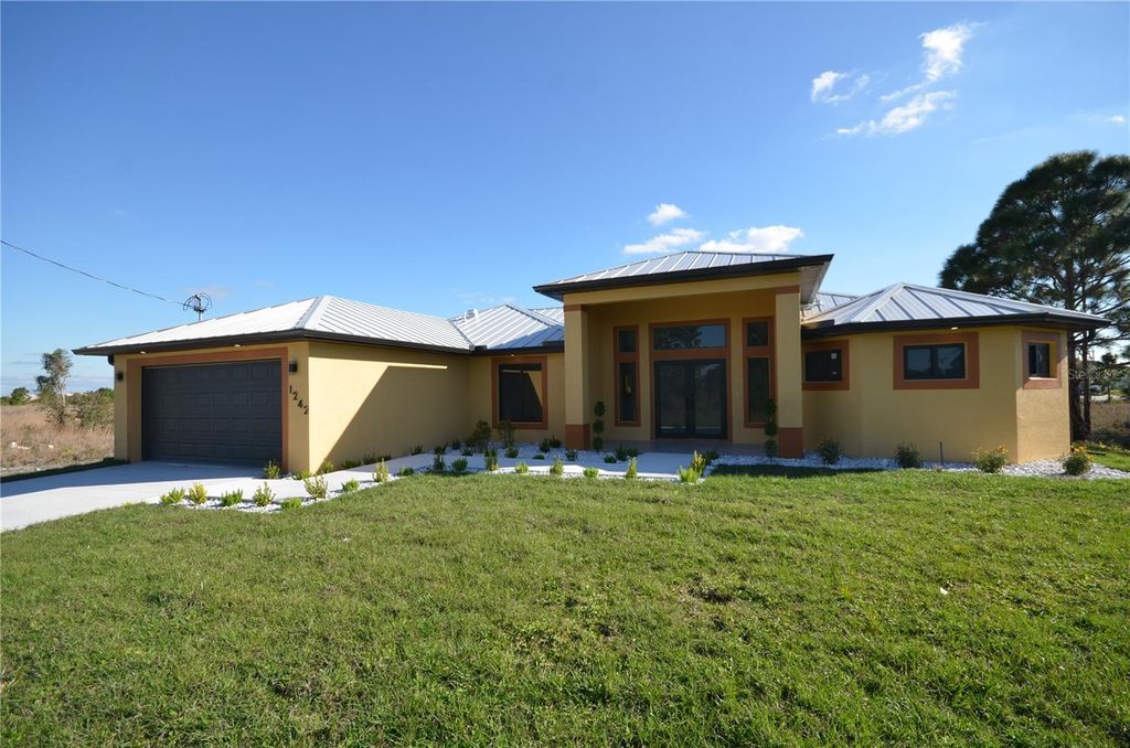 Photo of 1242 Hathor Street E, Lehigh Acres, FL 33974 (MLS # O6343861)