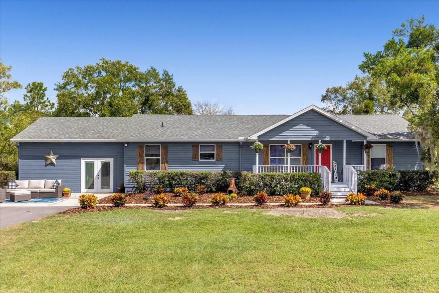 CHARMING 4-Bedroom Home on 13 ACRES with Pond and Barn - Discover the tranquility and charm of country living in this beautifully updated 4-bedroom, 2-bathroom home situated on 13 gated picturesque acres. With almost 2,200 square feet of living space, this property offers a perfect blend of modern updates and serene natural surroundings. The UPDATED Kitchen shines with a new farmhouse sink, faucet, and wood-like vinyl plank flooring. Countertops and cabinets have been refinished, complete with new hardware, light fixture and fresh paint further enhance the space. The primary bathroom has been completely remodeled, featuring a spacious walk-in shower with two shower heads, a bench, cubbies, and a frameless glass door. New high-end vanities, sinks, faucets, mirrors, light fixtures have been installed to enhance the luxurious feel of the space. The secondary bathroom has also been given a complete remodel, with new tile flooring, a high-end vanity, sink, faucet, mirror, light fixture, and a new toilet. New wood-like vinyl plank flooring, light fixtures, and fresh paint make the living areas inviting and modern. You will love the newly painted 2400 sq ft barn with framed in areas, screened room, upstairs and Pole Barn that can be finished out for additional living space, horses, equipment, or storage. The barn is equipped with power for workshop and RV hookup. This home had a NEW ROOF and NEW GUTTERS installed in 2021, NEW WATER HEATER in 2022 and a NEW FRONT PORCH added in 2023. This property is a true gem, offering modern comforts, a serene environment, and the space to live your dream country lifestyle. The property could also function as a mini farm as it is fenced and cross fenced for horses and cows. Contact us today to schedule your private showing and experience the beauty of this home for yourself.