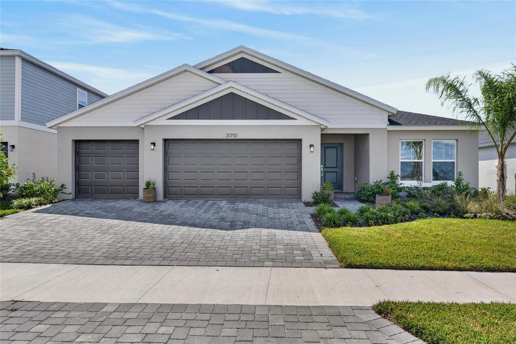 Photo of 31710 Chateau Manor Ln, Wesley Chapel, FL 33545 (MLS # TB8559052)