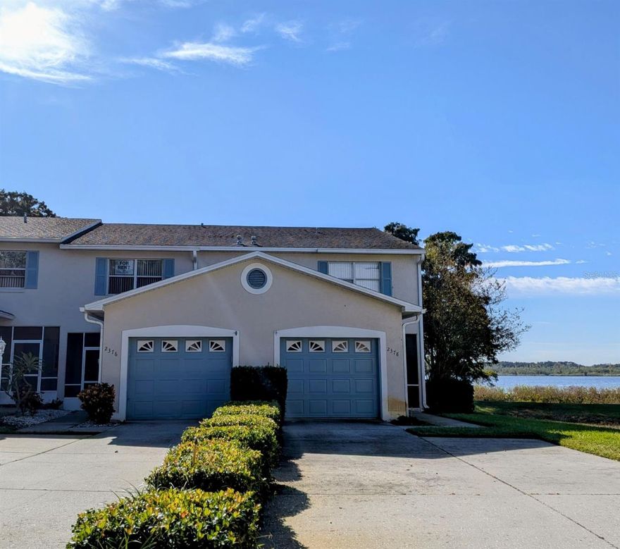 Available immediately, this freshly updated 2-bedroom, 2.5-bath waterfront townhome offers serene lake views and a peaceful cul-de-sac setting as the second-to-last end unit. Both upstairs bedrooms feature private en suite bathrooms, with brand new carpet and fresh paint throughout the home. Enjoy outdoor living from the spacious screened-in back porch and the screened balcony off the master bedroom, both overlooking the lake. The kitchen is equipped with a gas stove and dishwasher, and the downstairs includes a convenient half bath and an attached one-car garage with laundry hookups. No pets allowed. Lawn care, pest control, and access to the community pool are included.