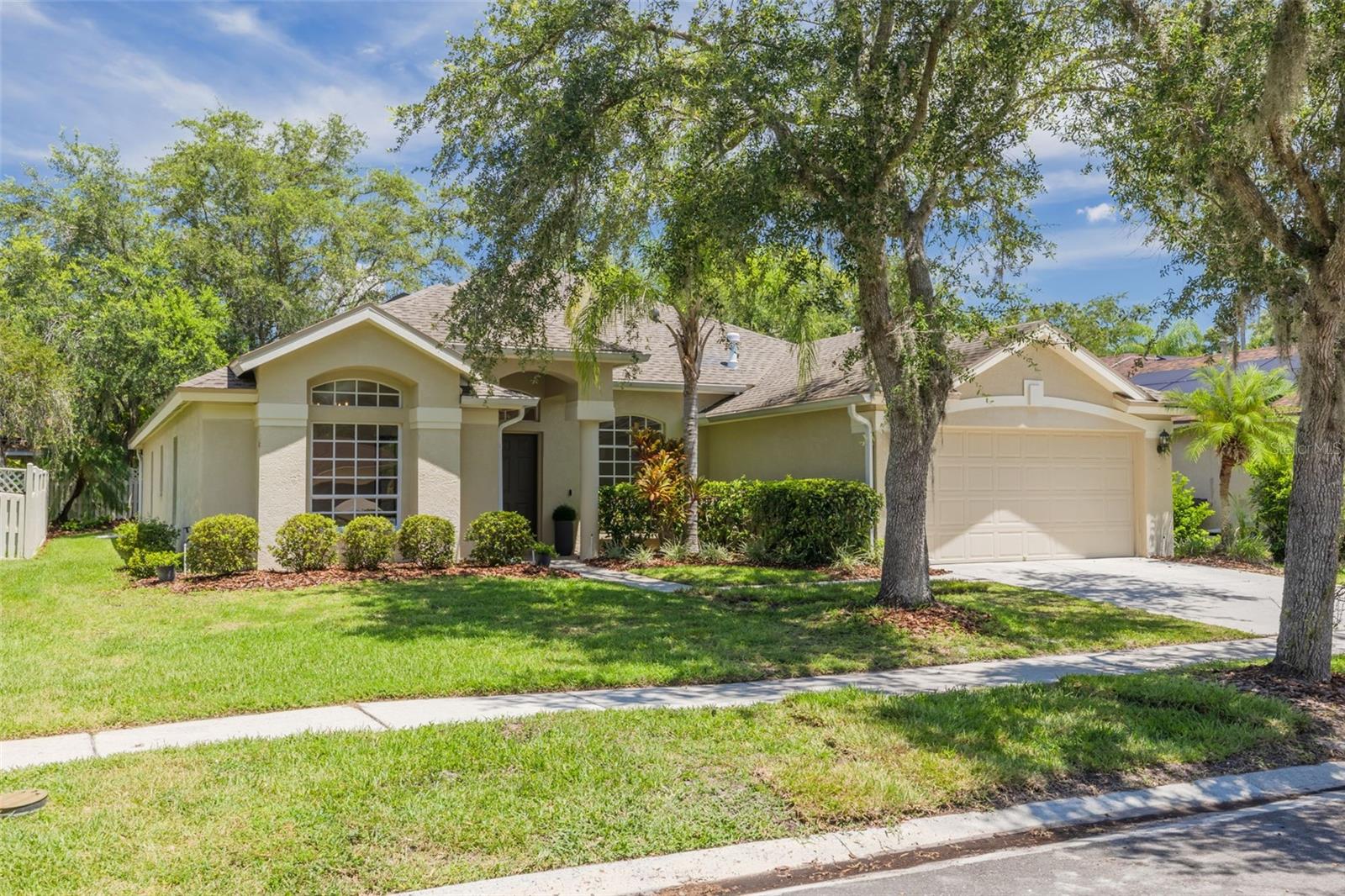 Welcome to your dream home nestled in the heart of New Tampa! As soon as you walk into this stunning 5-bedroom + den, 3-bathroom home, you'll be captivated by the open-concept design and thoughtful upgrades throughout. Located in the sought-after 24/7 manned gated community of Hunter's Green, this completely transformed home offers a beautiful living space that's perfect for those seeking comfort, convenience, and resort-style amenities.
Complete 2025 renovation with nothing left untouched! The spacious kitchen showcases brand-new quartz countertops, herringbone tile backsplash, new microwave and oven, and flows seamlessly into the family room and out to the large covered lanai, perfect for entertaining. Two elegant chandeliers grace the dining and kitchenette areas, creating an inviting ambiance for memorable gatherings. The private den provides the perfect space for working from home or quiet relaxation, while French doors at the front enclose a versatile room that could serve as an additional bedroom, formal living space, or home office.
The spacious primary suite has been completely transformed into a spa-like sanctuary featuring a stunning marble master bathroom with a freestanding soaking tub, frameless shower, and dual vanities with new quartz countertops. All three bathrooms have been fully renovated with modern quartz countertops, new toilets, sinks, and fixtures.
Throughout the main living areas, you'll find beautiful luxury vinyl plank flooring that's waterproof and scratch-resistant, complemented by an additional moisture barrier and backed by a 4-year labor and manufacturer warranty.
Premium details throughout include new 6" baseboard in every room, custom molding in the primary bedroom and one additional bathroom and bedroom, plus all new lighting and ceiling fans in every bedroom with multi-light control. This smart home features Nest thermostat, Nest doorbell, and electronic keyless entry for ultimate modern convenience. Fresh interior paint throughout creates a bright and welcoming atmosphere. The garage features a durable epoxy-finished floor for enhanced style and functionality. Convenience continues with included washer and dryer in the dedicated laundry room, plus a new water heater for reliable efficiency.
Hunter's Green offers an exceptional lifestyle with 24-hour manned gate security, designated bike lanes, playgrounds, lighted tennis, basketball, volleyball, soccer and baseball facilities, jogging trail with 15-station exercise circuit, and an off-leash dog park. The community is also home to Hunter's Green Country Club with its 18-hole Tom Fazio designed golf course and Tennis & Athletic Center. Additional premium features include refreshed landscaping that enhances curb appeal.
Situated just minutes from top-rated schools, premium shopping, dining, Busch Gardens, Adventure Island, MOSI, Flatwoods Nature Park, and I-75 access, this exceptional property offers the best of New Tampa living. Don't let this home slip by and experience a lifestyle upgrade in one of Tampa's most desirable communities!