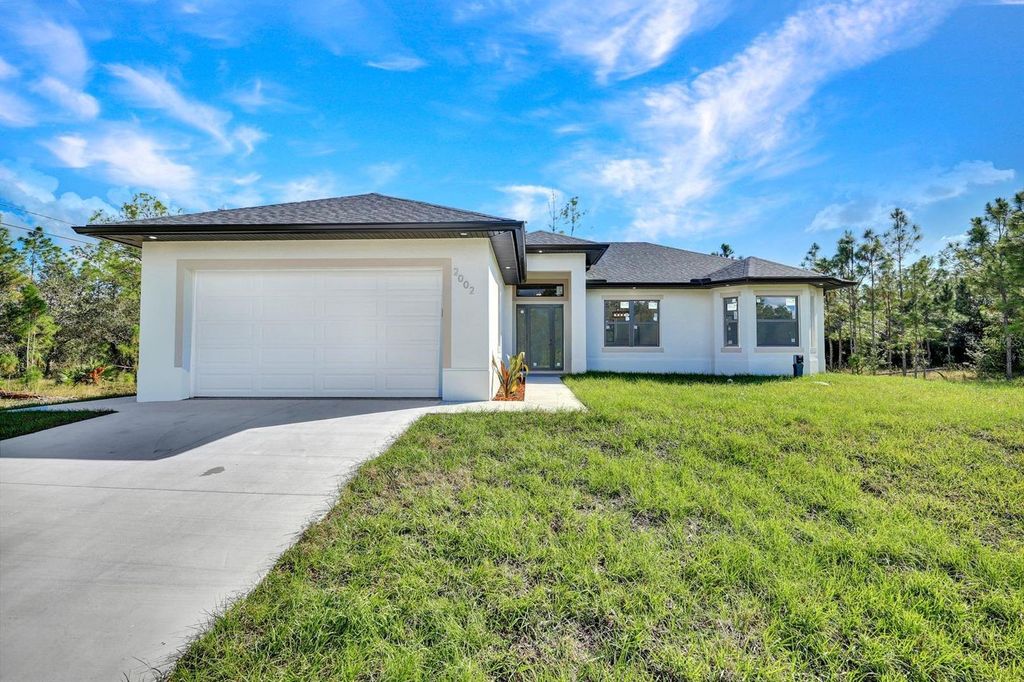 Photo of 2002 E 10th Street, Lehigh Acres, FL 33936 (MLS # TB8439709)