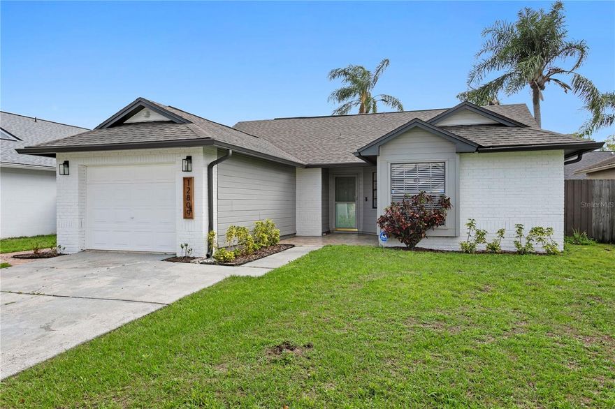 One or more photo(s) has been virtually staged. Price Improvement – Welcome to this beautifully renovated 3-bedroom, 2-bath block home in the highly desirable Hampton Park neighborhood of Carrollwood. With a recent price adjustment and a ROOF installed in 2024, this home offers exceptional value and true move-in-ready peace of mind. Thoughtfully updated inside and out, the residence features stylish modern flooring, a fully refreshed kitchen, bathrooms with contemporary finishes, and sleek light fixtures throughout enhancing the home’s clean, modern appeal. Enjoy the comfort of a screened-in side porch, perfect for relaxing or entertaining, along with a fenced backyard accented by brick pavers for low-maintenance outdoor living. Located in the heart of Tampa, this home offers unbeatable convenience—just minutes to Carrollwood Village Park (dog park, skate park, splash pad, and playground), Downtown Tampa, Tampa International Airport, Raymond James Stadium, and an abundance of shopping and dining. A perfect blend of modern updates, major improvements, and prime location, this Carrollwood gem is ready to welcome its new owners.