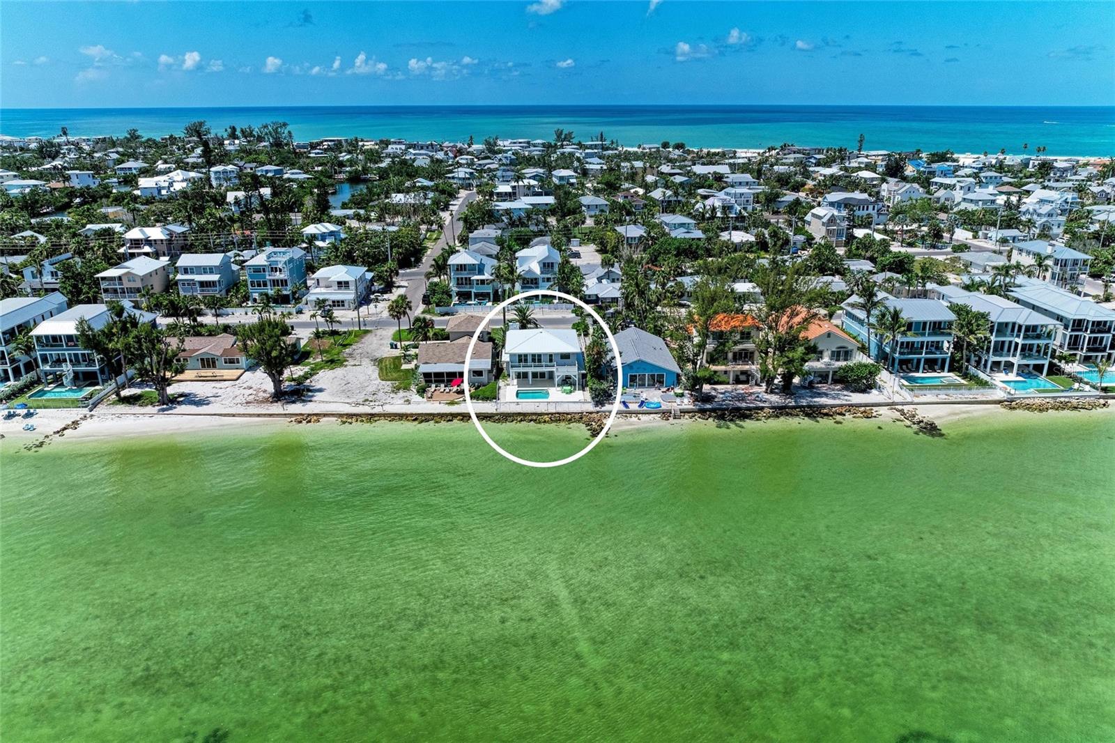 One or more photo(s) has been virtually staged. Waterfront Living on Anna Maria Island – 4BD/3BA Bayfront Home with Pool & Unmatched Views!
Discover your slice of coastal paradise on the prestigious north end of Anna Maria Island. This beautifully updated 4-bedroom, 3-bath bayfront home offers nearly 3,000 square feet under air, a private heated pool, and some of the most breathtaking views of Tampa Bay and the iconic Sunshine Skyway Bridge.
Step inside the white picket fence to a world where time slows down. Relax on the generous front porch, sip a drink, and listen to the boats as they pass by. From the moment you walk through the front door, expansive water views fill the open-concept living space, creating a sense of calm and connection to the sea.
The main living area boasts high ceilings, light wood laminate flooring, and 8-foot sliding doors that open to a screened porch and oversized bayfront deck, perfect for entertaining or watching the sunrise over the water. A cozy wood-burning fireplace anchors the great room, while the newly updated eat-in kitchen features Quartz countertops, new stainless steel appliances and white shaker cabinets.
Two guest bedrooms and a full bath are located on the main level. There is also a one car gargage, perfect for a golf cart and beach gear. Upstairs, you'll find two spacious master suites, each with en-suite baths, sitting areas, and private access to a deck overlooking the bay—ideal for morning coffee and soaking in the peaceful sounds of the water.
Whether you're seeking full-time island living, a family beach retreat, or a vacation rental investment, this home checks every box: prime bayfront location, updated interior, private pool, amazing views of Tampa bay and proximity to Anna Maria Island’s world-class beaches, dining, and shopping.
This is true waterfront living—where coastal charm meets modern comfort, and every day feels like a vacation.
Note: Property information received from third-party sources is considered reliable but is not guaranteed. All information should be independently verifified by buyers and buyers' agent.