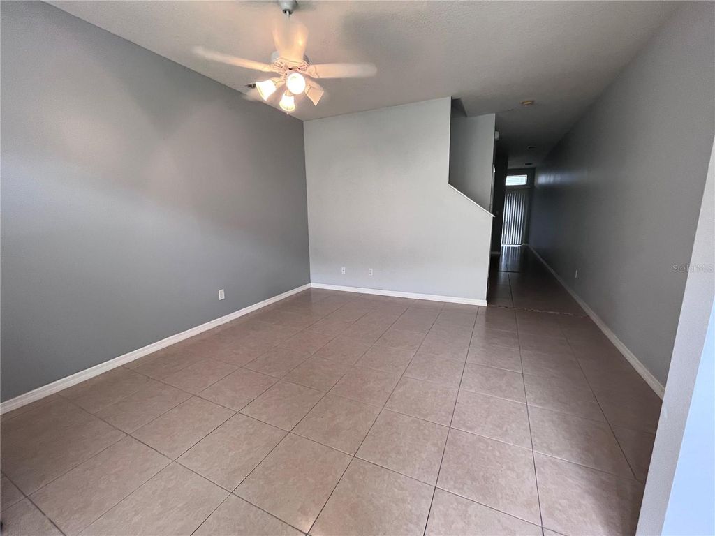 Photo of 6007 Scotchwood Glen #31, Orlando, FL 32822 (MLS # O6397435)