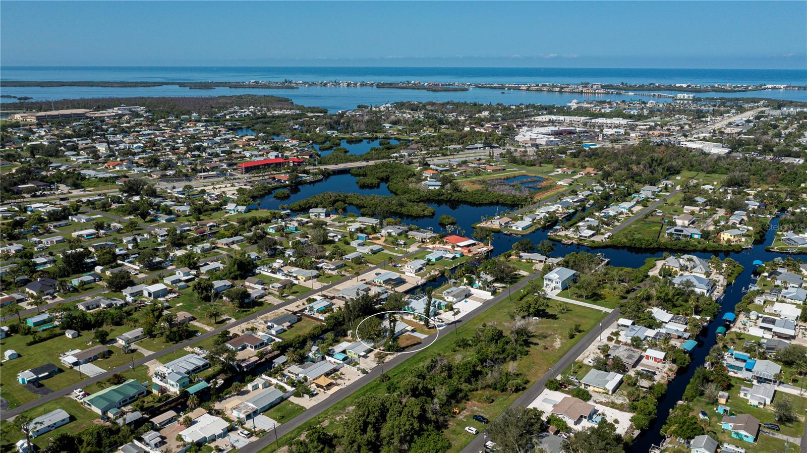 RARE FIND — OPPORTUNITY IS KNOCKING!!! 95 FEET of SALTWATER FRONTAGE - a QUICK 10 MINUTE BOAT RIDE out to LEMON BAY and approximately 20 minutes to the wildly popular Ski Alley!! POOL HOME!!! A mere 5 minute golf cart ride to multiple amazing restaurants including Farlow’s on the Water, Mama’s and The End Zone Sports Bar! This phenomenal neighborhood is eligible to join The Englewood Gardens Beach Club, which is a private deeded beach on Englewood that is complete with a clubhouse, private parking, picnic tables, grills and on the bay side, a fishing pier/kayak launch!! Located on a dead end street in South Englewood, it’s less than 7 minutes by car to Englewood Beach and less than 5 minutes to the Publix shopping center! This blank slate **BLOCK HOME** features a large Florida room plus a living room, 2 bedrooms PLUS bonus room, 1 bathroom (could easily add a 2nd by the laundry room, making a pool access bathroom) and a converted carport that can be made into a garage once again. ON CITY SEWER and CITY WATER!! NO HOA and NO DEED RESTRICTIONS!! The current owner has already prepped the house for you to add your own finishing touches. Needs a new roof, needs a new A/C and the condition of the hot water heater is unknown. Dock is already in place but needs work. This is coastal living at its finest and is being offered at a cost that you will not find anywhere else in Englewood!