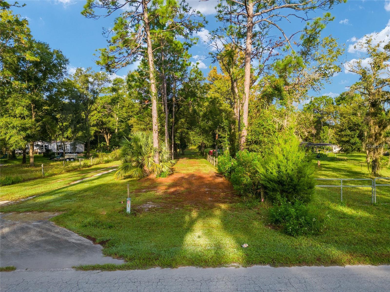 This lush 1.5-acre parcel in Marion County offers a rare opportunity to build a custom mini-farm mere minutes from the World Equestrian Center – Ocala, the largest equestrian complex in the United States, featuring 16 outdoor arenas, five indoor arenas, a full veterinary hospital, boutiques, dining, luxury lodging, and more. Shaded by mature trees and zoned A-1 for agricultural use, the property is perfectly suited for a barn, paddocks, pasture, and residence—and benefits from the region’s limestone-rich soils and equine-focused infrastructure. With access to golf-cart trails and upscale amenities—including on-site veterinary services, 24-hour laundry, and secure gated communities like Golden Ocala—the lot combines resort-style convenience with authentic Horse-Capital-of-the-World charm. Whether you’re planning to breed, train, show, or simply enjoy rural living in one of Florida’s fastest-rising equestrian real-estate markets, this property offers both lifestyle prestige and long-term investment potential. Please call to come and view this spectacular property today.
