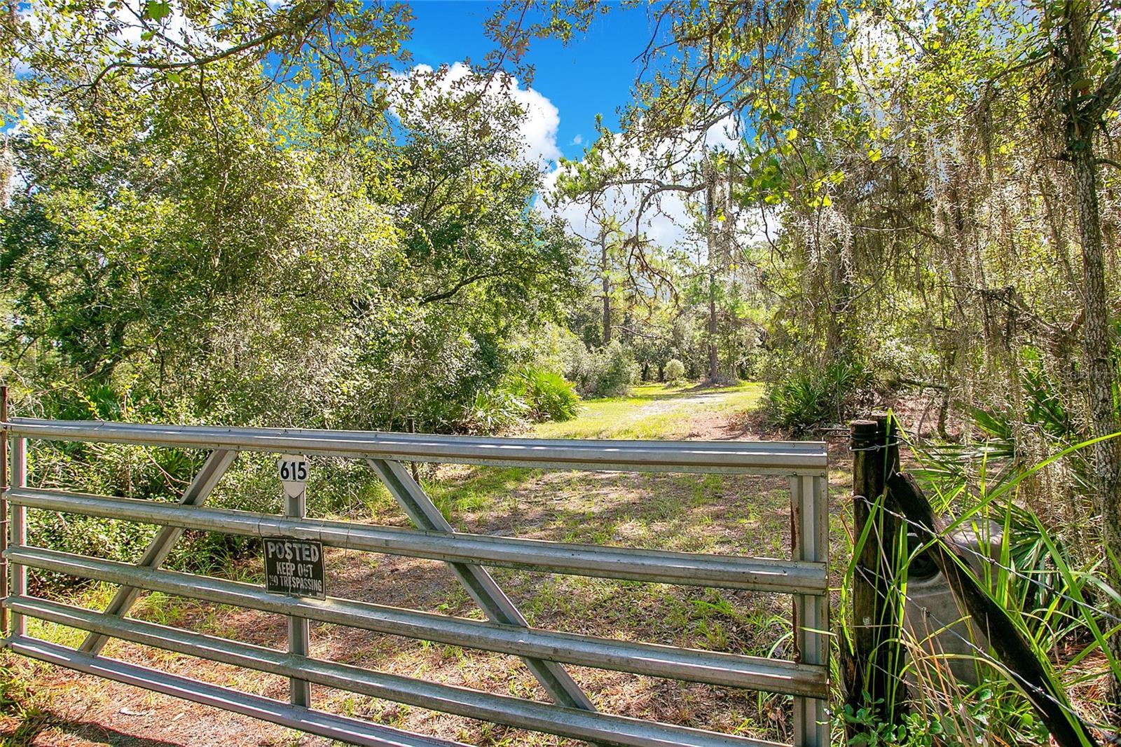 Now presenting 615 Eden Dr.! This 5.62+/- acre property has had the same owners for over 45 years and they are ready to SELL. This prime piece of real estate is located off a private dirt road and showcases a stunning Oak Hammock. Enjoy living in the country but within a short distance of the beaches, Lake Nona and Saint Cloud. The property is currently used as a residential residence however the Future Land Use allows for 8 homes per acre and offers deeded access to Center Lake. The possibilities are endless with this piece of property, whether you want to build a custom home and enjoy the Florida lifestyle or are a developer looking to build within Osceola County. *Dwelling was involved in a fire and is not habitable.