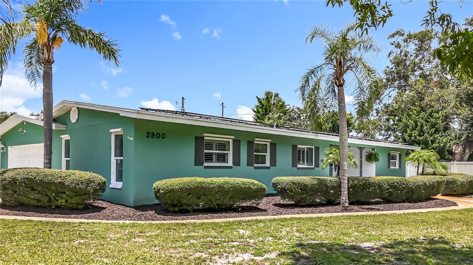 Welcome to 2900 Park St N, a beautifully updated pool home located in the highly desired Jungle Terrace neighborhood of St. Petersburg. Nestled on a spacious 13,260 sq ft corner lot, this 4-bedroom, 3.5-bathroom home offers a rare layout with three primary suites—perfect for guests, multigenerational living, or creating private work-from-home spaces. Step inside to find a bright, open layout with newer energy-efficient insulated windows, custom blinds, and hurricane shutters throughout. The kitchen is both stylish and functional, featuring granite countertops, European-style cabinetry, stainless steel appliances, glass tile backsplash, and a breakfast bar ideal for casual meals or entertaining.
Out back, enjoy your own screened-in lanai with a sparkling pool and a low-maintenance backyard, complete with a fenced-in grassy area that’s perfect for a dog run or extra outdoor space to enjoy. Extensive tropical landscaping and multiple fruit trees in the front and side yards add curb appeal and create a welcoming first impression.
The home is equipped with solar panels that will be paid off at closing, helping to keep energy costs minimal for years to come. Located in flood zone X500, there’s no requirement for flood insurance, offering both peace of mind and financial benefit. Plus, the property stayed high and dry during recent storms, further highlighting its secure and elevated positioning.
As a bonus, residents enjoy deeded access to a private waterfront park just down the street, offering a peaceful spot to launch a kayak or paddleboard into Boca Ciega Bay, spend the afternoon fishing, or enjoy a quiet picnic by the water. This prime location puts you close to shopping, dining, and local parks, with Tyrone Square just minutes away and the Gulf beaches easily accessible. You’re less than 15 minutes from vibrant downtown St. Pete, about 25–30 minutes to Tampa International Airport, and approximately 20–25 minutes to St. Pete–Clearwater International Airport.
Whether you’re relocating or simply ready to upgrade your lifestyle, this home offers the perfect blend of comfort, functionality, and Florida charm. Come experience it for yourself!