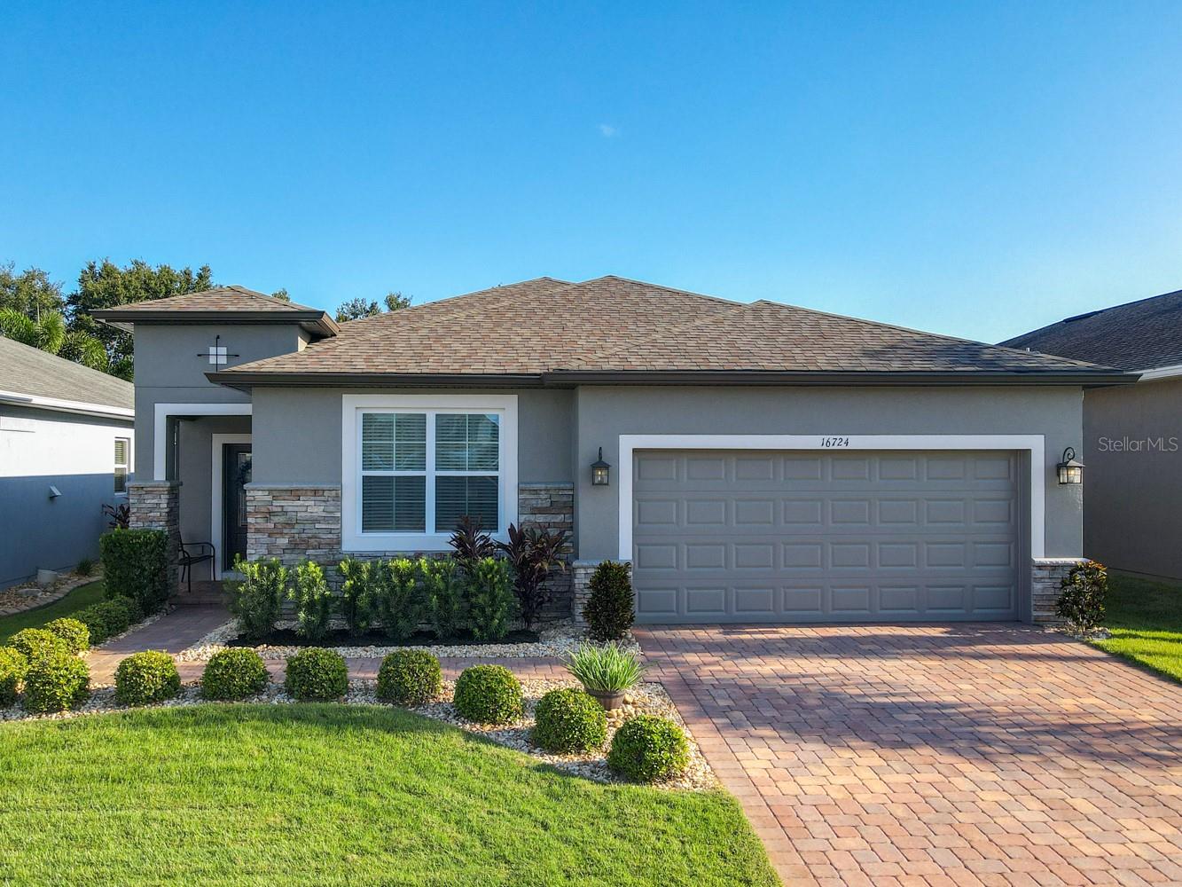 Pristine lifestyle, and luxury come together in this stunning 3-bedroom, 2-bath home in the sought-after Johns Lake Landing Community! This home offers the best convenience and comfort, perfectly positioned near the new Costco, Tesla, and the vibrant Clermont markets. With easy access on and off the Turnpike, you're 23 minutes from Downtown Orlando. Families will appreciate the excellent public schools in the area, and you're just 8 minutes from Montverde Academy. Enjoy no carpet throughout, elegant granite and Corian counters, a spacious primary suite with dual closets, and a lanai perfect for outdoor relaxation. full of upgrades that make this home a true standout. Take advantage of this gem in the heart of Clermont!