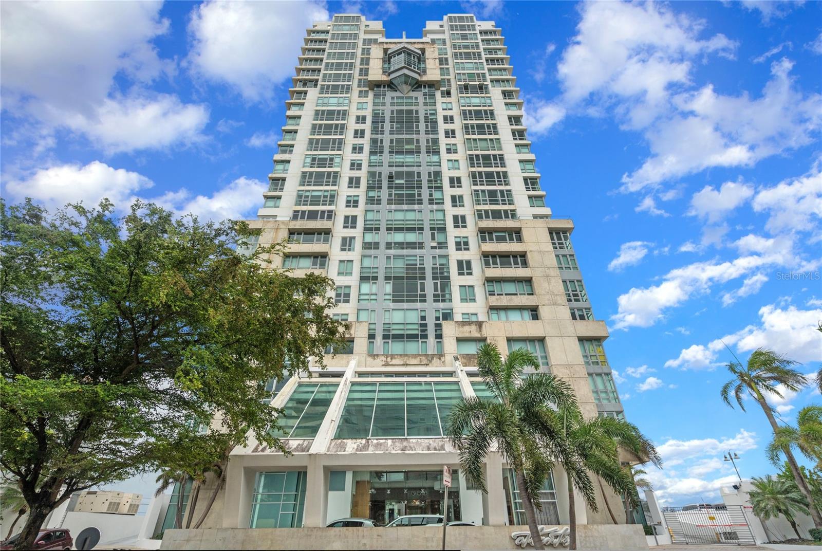 Perfectly positioned just minutes from Condado, Old San Juan, and the beach, Atlantis 305 blends panoramic views, smart design, and strong investment performance into one refined package.
This 1,105-square-foot residence features one bedroom and two full bathrooms in a loft-style layout that invites flexibility. With soaring ceilings and natural light pouring in through expansive windows, the space can easily be reconfigured to accommodate a second bedroom.
The open kitchen is thoughtfully appointed with modern appliances, ample cabinetry, and a discreet laundry closet. The generous living and dining area offers an effortless flow, while the primary suite includes a walk-in closet and ensuite bath. A second full bathroom enhances guest privacy and utility.
The building allows for short-term rentals, and the property is currently generating an average of $5,000 per month—with potential for more. Sold fully furnished and equipped, it’s turnkey for investors or end users alike.
Two covered parking spaces, guest parking, 24/7 concierge and security, a fitness center, business lounge, water cistern, and full power generator round out the lifestyle.
Located 5 minutes from Condado, 10 minutes from the airport, and within walking distance to the beach, Atlantis 305 delivers versatility, comfort, and proven returns in one of San Juan’s most connected neighborhoods.
