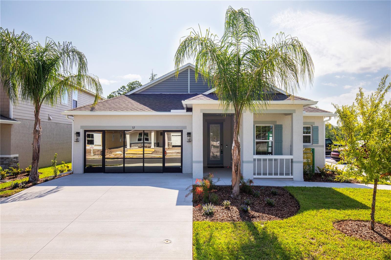 MODEL home offering a sale / leaseback opportunity. Move-In Ready & Packed with Upgrades! Located in the new resort-style community of The Enclave at Seminole Palm, just 10 minutes from Flagler Beach, this beautifully crafted home showcases exquisite finishes, a spacious layout, and the modern comforts you’ve been searching for.
Designed with both elegance and functionality in mind, The Drexel offers a spacious, open-concept layout featuring three generously sized bedrooms, two luxurious bathrooms, and an extended screened-in lanai with soaring 9'4" ceilings—perfect for enjoying Florida’s beautiful weather.
Step through the elegant 8' full lite front door into a home where style meets substance. You're welcomed by 9'4" ceilings throughout and crown molding, enhancing the openness and architectural appeal of every space. The home features luxury vinyl flooring throughout, blending durability with a clean, modern aesthetic.
At the heart of the home is the inviting great room, which flows seamlessly into the chef’s dream kitchen. Here you’ll find a large island with built-in shelves and eating bar, quartz countertops, upgraded cabinets, tile backsplash, and modern appliances, including an ENERGY STAR® French door refrigerator—making it ideal for both daily living and entertaining. Just off the kitchen is a charming breakfast nook with an additional window, creating the perfect sunny spot for morning coffee or casual meals.
The owner’s suite serves as a private sanctuary, complete with a generous walk-in closet and a spa-inspired en-suite bath featuring a double vanity and beautifully tiled shower. Two secondary bedrooms are tucked away for privacy and share a well-appointed full bath, perfect for family or guests.
Thoughtfully designed for everyday convenience, the home includes a convenient laundry/mud room with washer and dryer provided, located just off the 2-car garage. Additional smart features include a Ring Video Doorbell, Smart Thermostat, Keyless Entry Smart Door Lock, and Deako switches throughout.
Upgrades continue outdoors with architectural shingles, hurricane shutters, a paved driveway, irrigation system, and sidewalk-lined streets, creating a community feel you’ll love coming home to.
Enjoy peace of mind with the confidence of a full builder warranty.
The Drexel is more than just a home—it’s a lifestyle. Come experience the perfect blend of luxury and Florida living in this exceptional new community.
*Note: temporary sales office will convert to 2 car garage