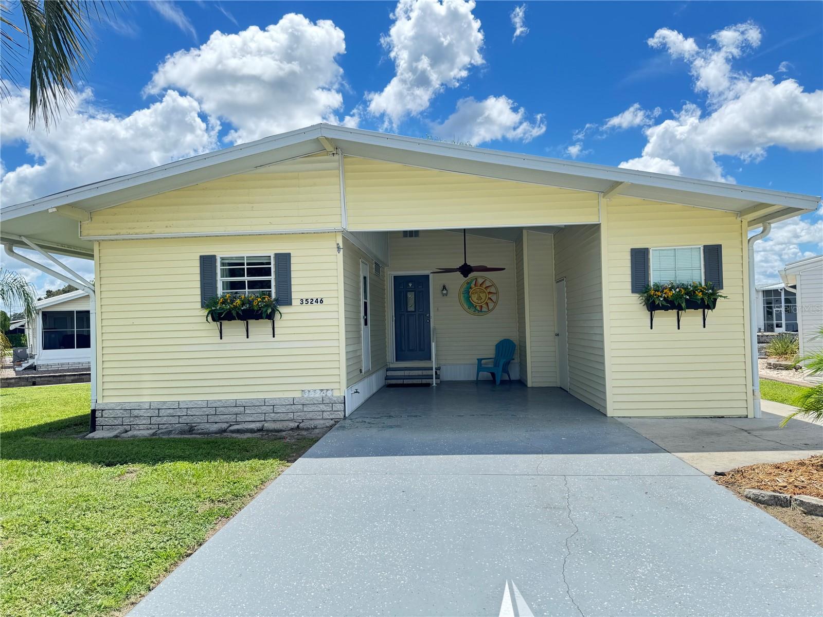 This beautiful waterfront property, on a quiet cul-de-sac in American Condominium Park Zephyrhills, is the perfect Florida escape! The spacious living room overlooks the water and allows plenty of room to relax. The screened porch overlooks the pond and has beautiful sunsets. The dining room is perfect for entertaining. The kitchen has been updated with stainless appliances. The bathroom has a large walk-in shower. The master bedroom has built-in closets & bureaus. The bedrooms are split for added privacy for guests. And a separate laundry/utility room and an additional shed add valuable storage space. Seawall maintenance is the owner's responsibility. The roof was replaced in 2025 and comes with a transferable warranty. This home is ideal for winter getaways or affordable year-round living in a fabulous park. THE SELLERS WANT YOU TO KNOW THEY ARE MOTIVATED TO SELL.
American Condominium Park is a 55+ gated community with heated pool, clubhouse, exercise room, sauna, hot tub, tennis/pickleball courts, horse shoe pits, shuffleboard, and many more amenities. A friendly active community with dances, dinners, and entertainment. Perfect for full time affordable living and cost effective for snow birds. No rent as you own the land. Reasonable monthly fee that maintains the common elements and amenities for your use. Schedule a showing today!
