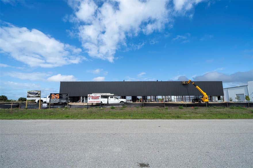 One or more photo(s) has been virtually staged. Under Construction. ECAP Zoned Flex Condos. 16 Units available across two - 25,000 Sq Ft. Buildings. Each unit will be 3,125 Sq Ft. Units may be bought individually or in bulk. Each unit will feature showroom space, 3 individual offices, and 1 ADA compliant bathroom. Warehouse space will include roll up door in rear, and 26+ feet ceiling heights. Property is conveniently located near the Punta Gorda airport 5 minute car drive to I75 Jones Loop Ramp. Enjoy the vibrant community of Punta Gorda featuring fine dinning, shopping & more Estimated completion date for the buildings is Quarter 4 of 2026. Condo fees are to be determined. For more information call. Information is deemed reliable but is not guaranteed.