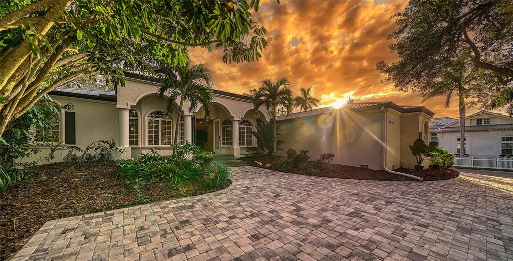 "West of Trail" beauty is now freshly remodeled with a brand-new roof, yes a BRAND NEW ROOF! This 3500+ square foot home was originally built by Vision Homes in 2002 and is nestled on a private 20,000 square foot lot with lush landscaping, beautiful mature tress and a south facing backyard. New exterior paint and interior paint along with a gorgeous new interior make this home feel like it's brand new!
Highlights include new engineered wood flooring throughout and exquisite new lighting and ceiling fans. Boasting four bedrooms and a study this home has the perfect split floorplan with the primary wing on the east side of the home and the remaining three bedrooms, family room and laundry on the west side. The kitchen features new shaker style cabinets with gleaming quartz counters, marble backsplash, new GE Cafe stainless appliances and a walk in pantry. The primary suite is grand with french doors to the pool and spa, two bathrooms and large walk in closets! The study is in the front of the house with French doors and a beautiful view of the east and early morning sun. The living room has a wood burning fireplace and entrance to one of the two covered areas outside! The outside space also offers a fireplace and has been updated with new pavers, new pool surface, new pool tile and new pool equipment! The pool cage has been painted and totally rescreened! You will fall in love with the feature wall located in the family room with new electric fireplace, huge built in television and decorative wood detail! The family room sliders pocket, so entertaining is a continuous flow inside to outside enjoying multiple covered areas and complete privacy. Guest bedrooms #2 & #3 have walk in closet and share a jack and jill bath with dual sinks. Bedroom #4 is conveniently located next to a full bath and has it's own entrance in the rear of the home, making it a perfect secondary study. The Laundry room has a new washer & dryer and you will love the additional cabinetry upon entering the home from the garage. Both air conditioners are brand new and a new hot water heater has been added as well! This magical setting is unique with beautiful landscaping and nestled within a tropical paradise with total privacy. An oversized lot west of trail is rare There are three parking areas and a two car garage. This home is in one of Sarasota's most treasured neighborhoods with easy access to Siesta Key, Southside Village and Tamiami Trail. If you are looking for immediate occupancy, look no further as paradise awaits but won't last long! Call for your private tour today!